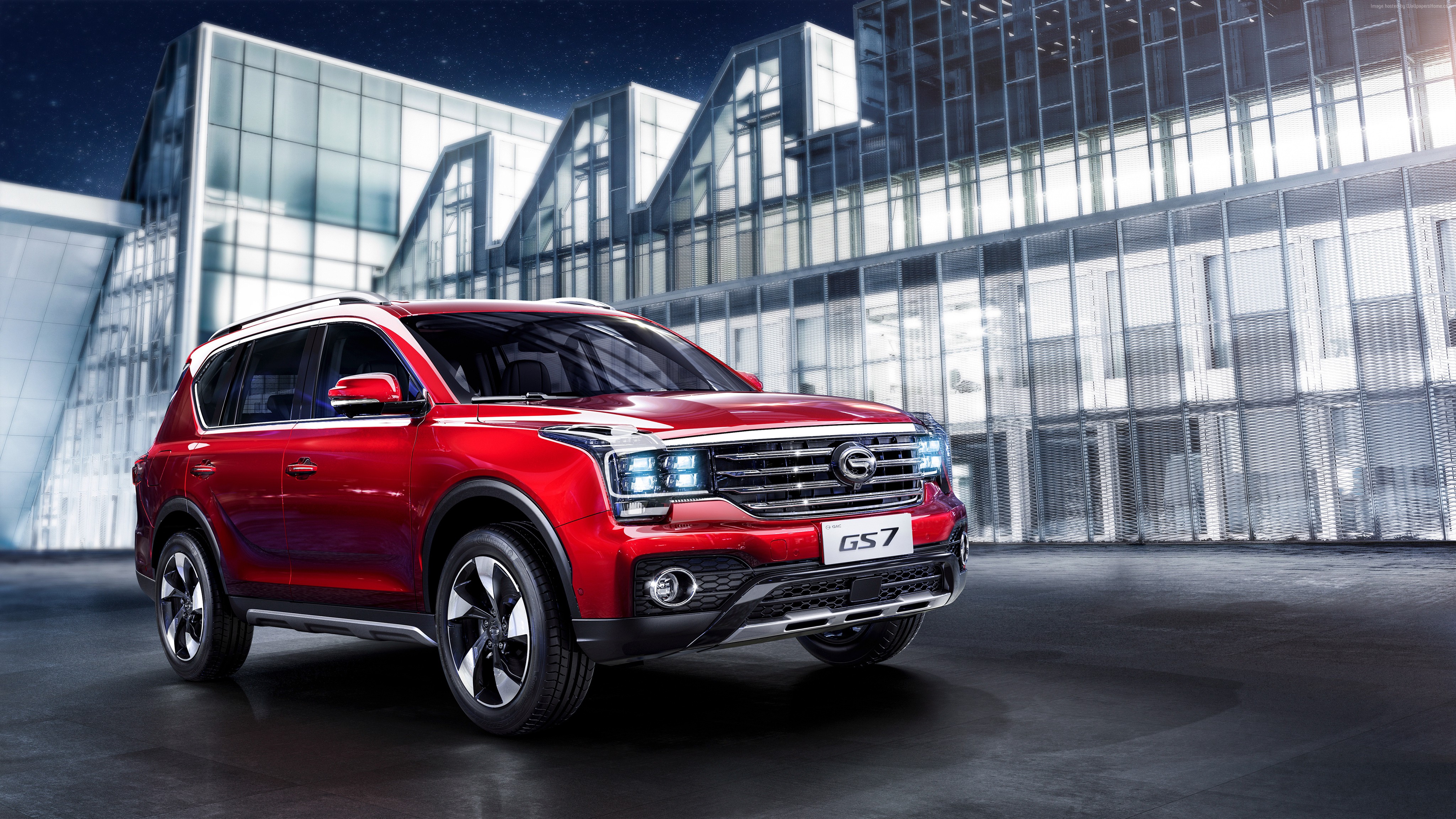 Red 2018 Trumpchi GS7 SUV in front of modern building HD Wallpaper