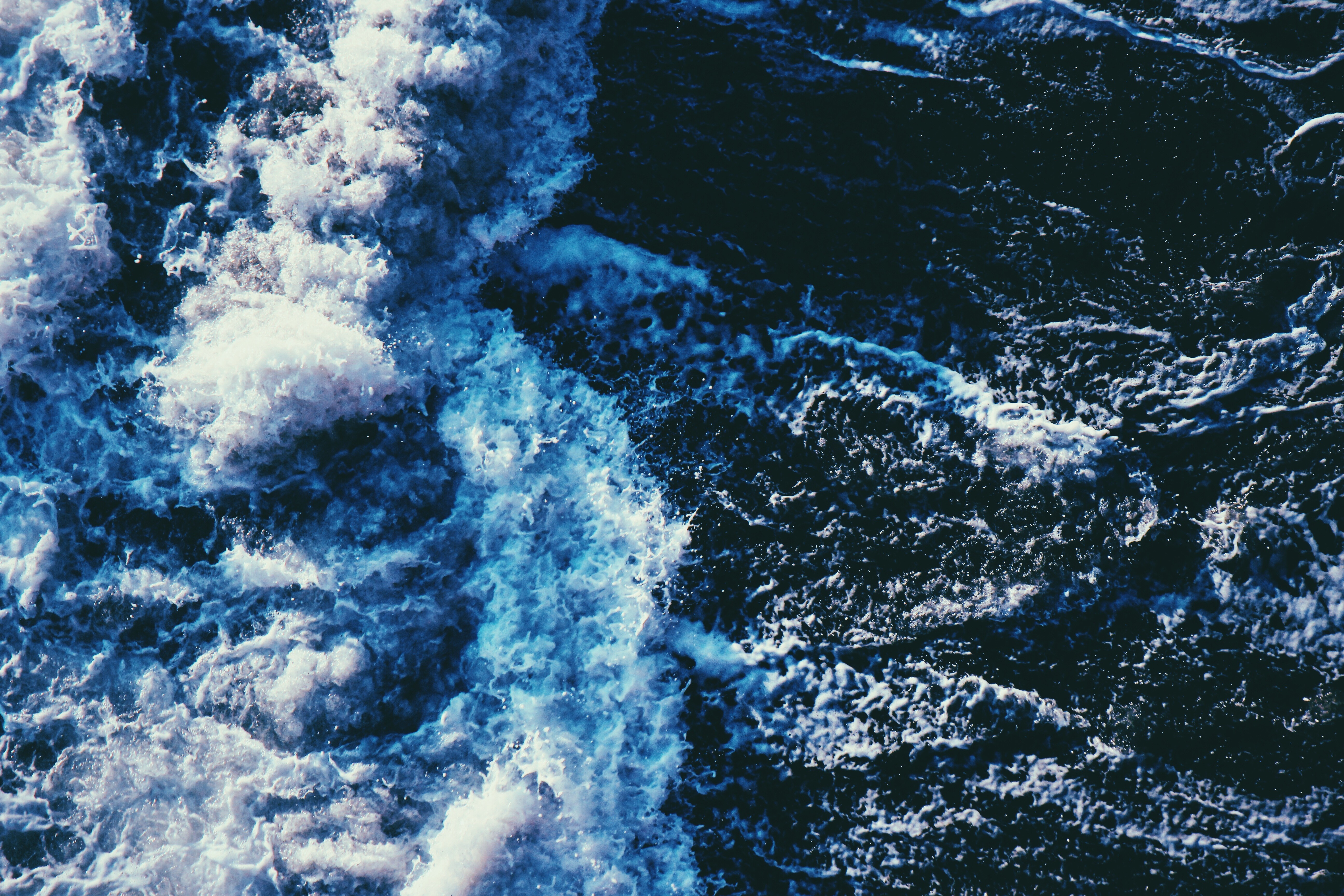 Dark blue ocean water with white waves HD Wallpaper