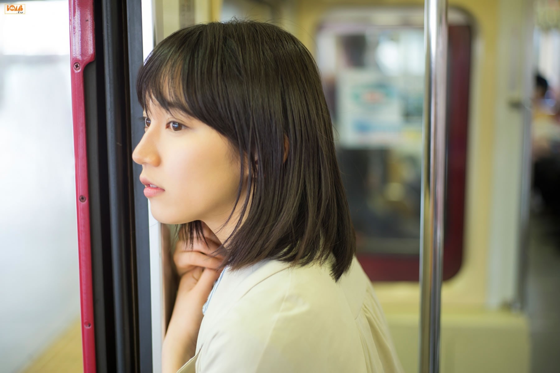 Riho Yoshioka looking out a train window HD Wallpaper