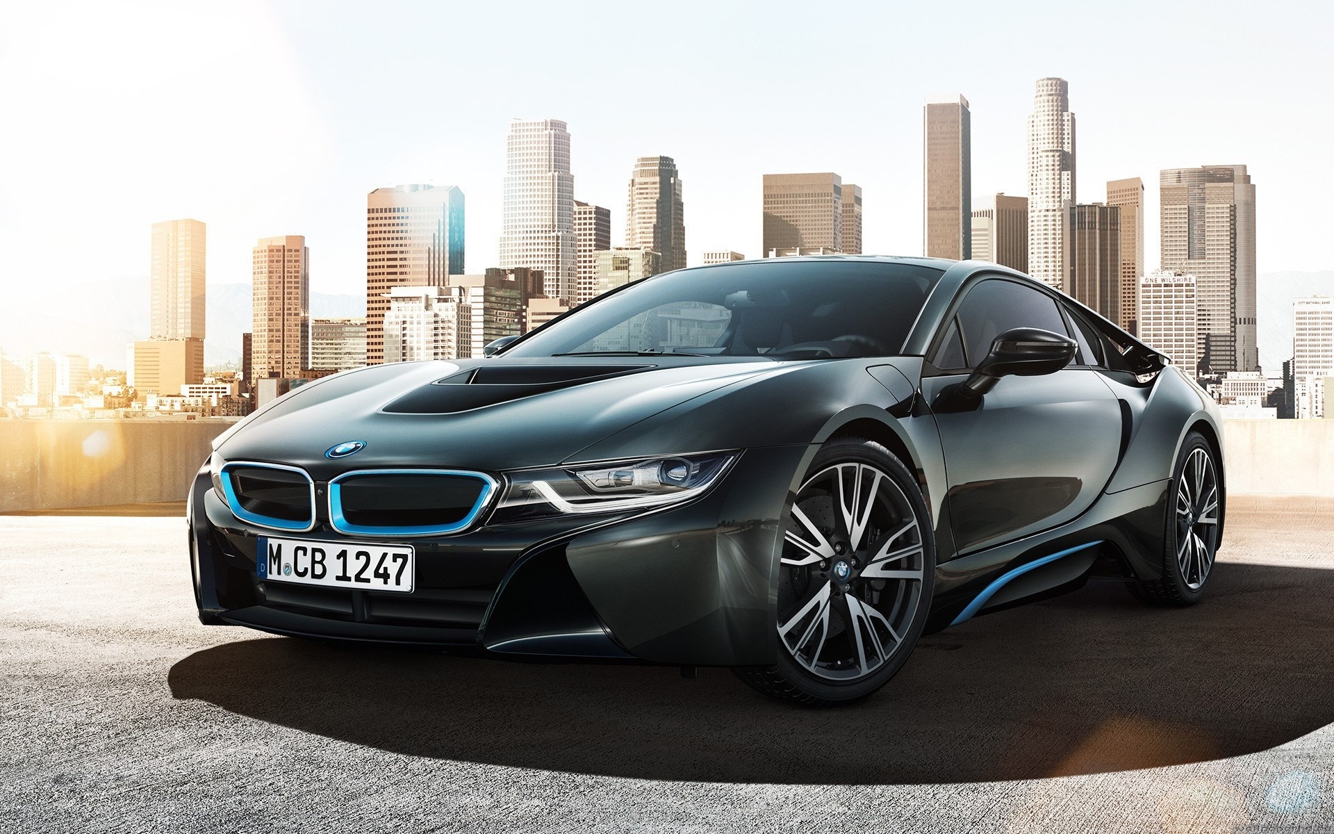 BMW i8 sports car in a cityscape HD Wallpaper