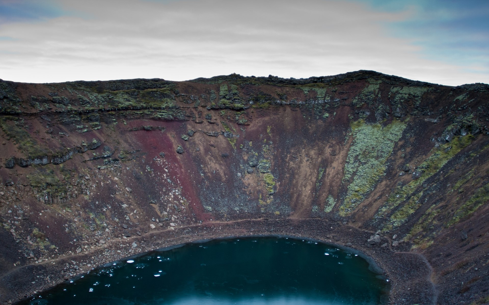 Crater lake with colorful volcanic rock walls HD Wallpaper