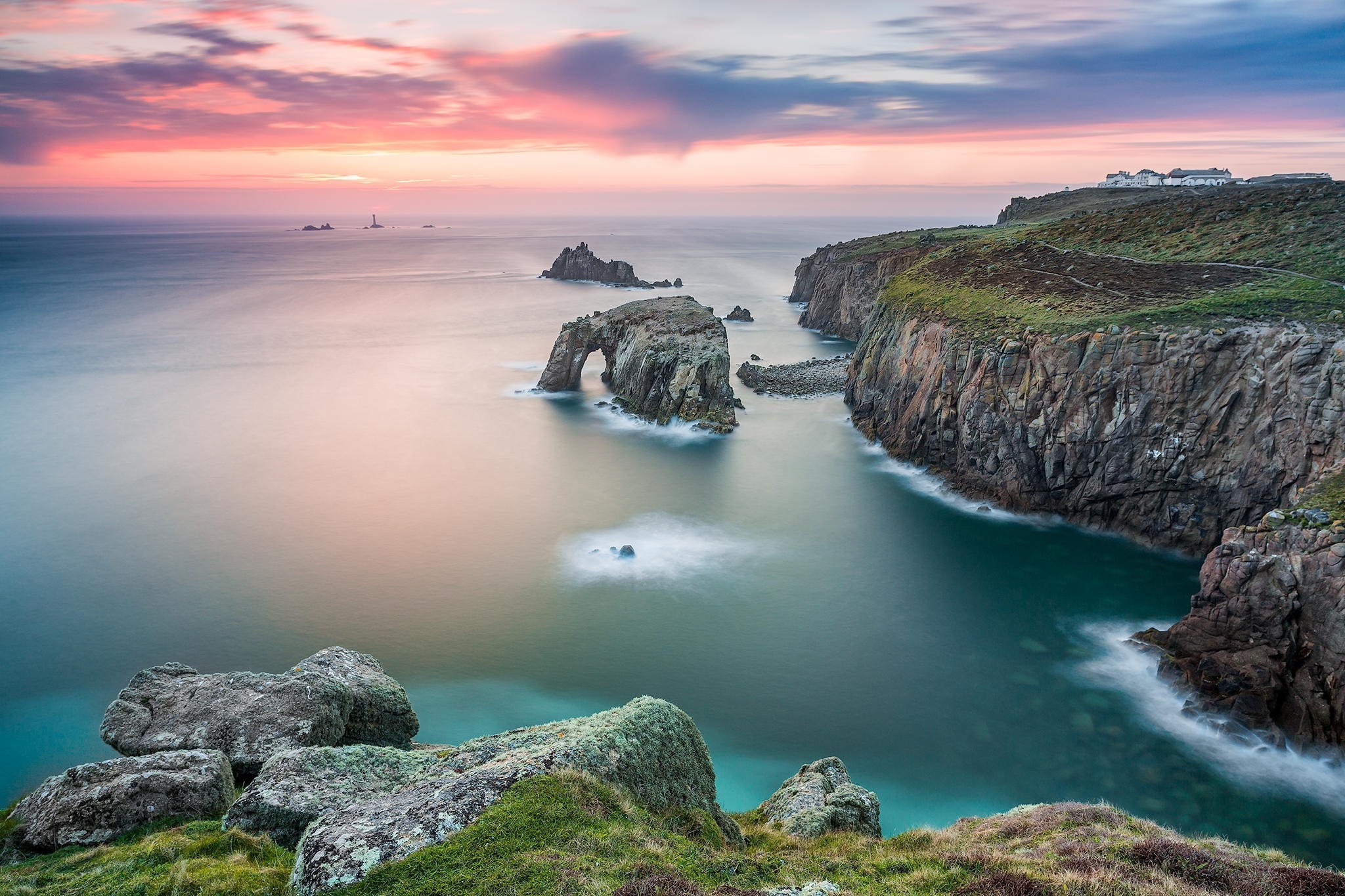 Coastal cliffs and sea arch at sunset HD Wallpaper