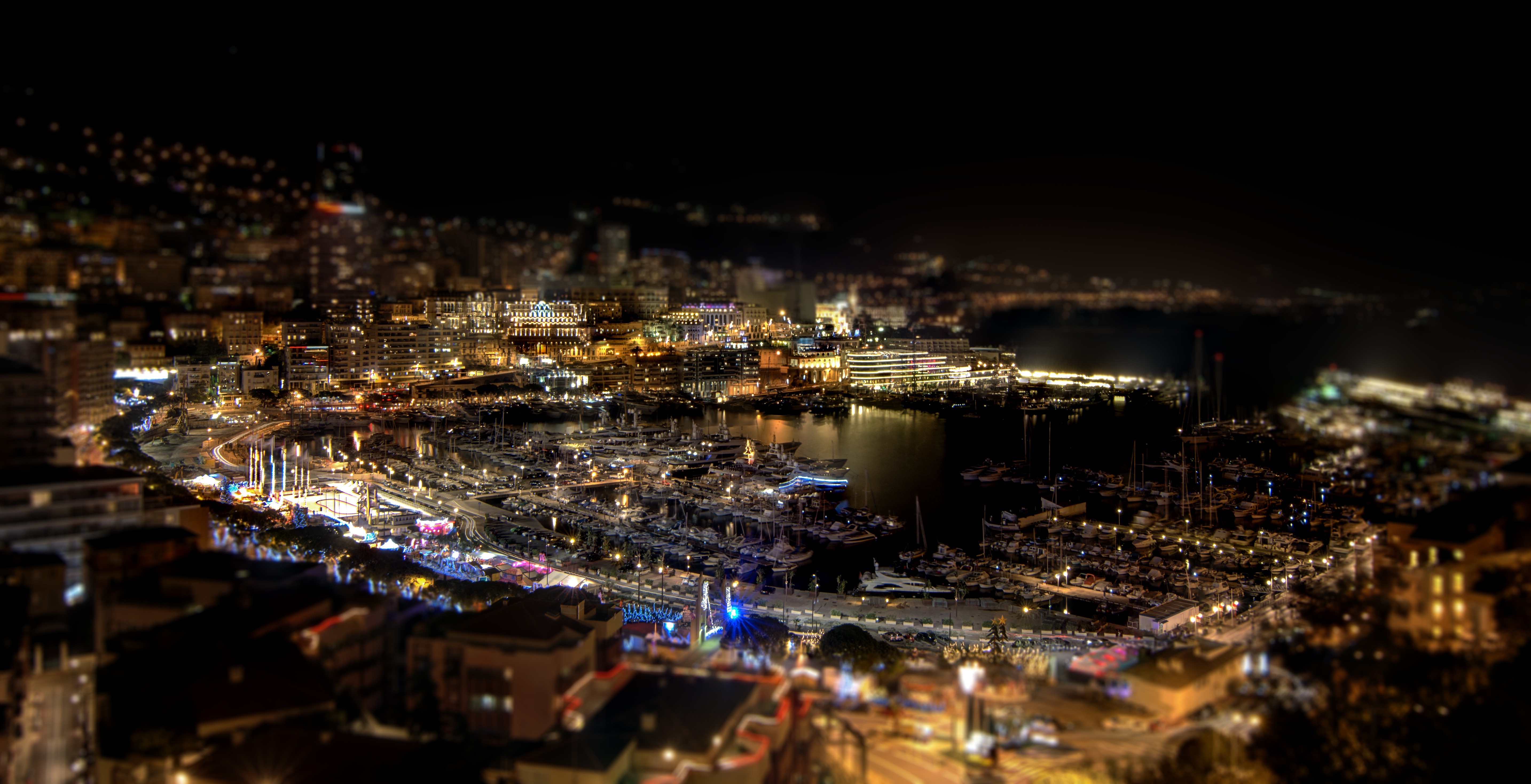 Night cityscape of a harbor with many boats and buildings HD Wallpaper