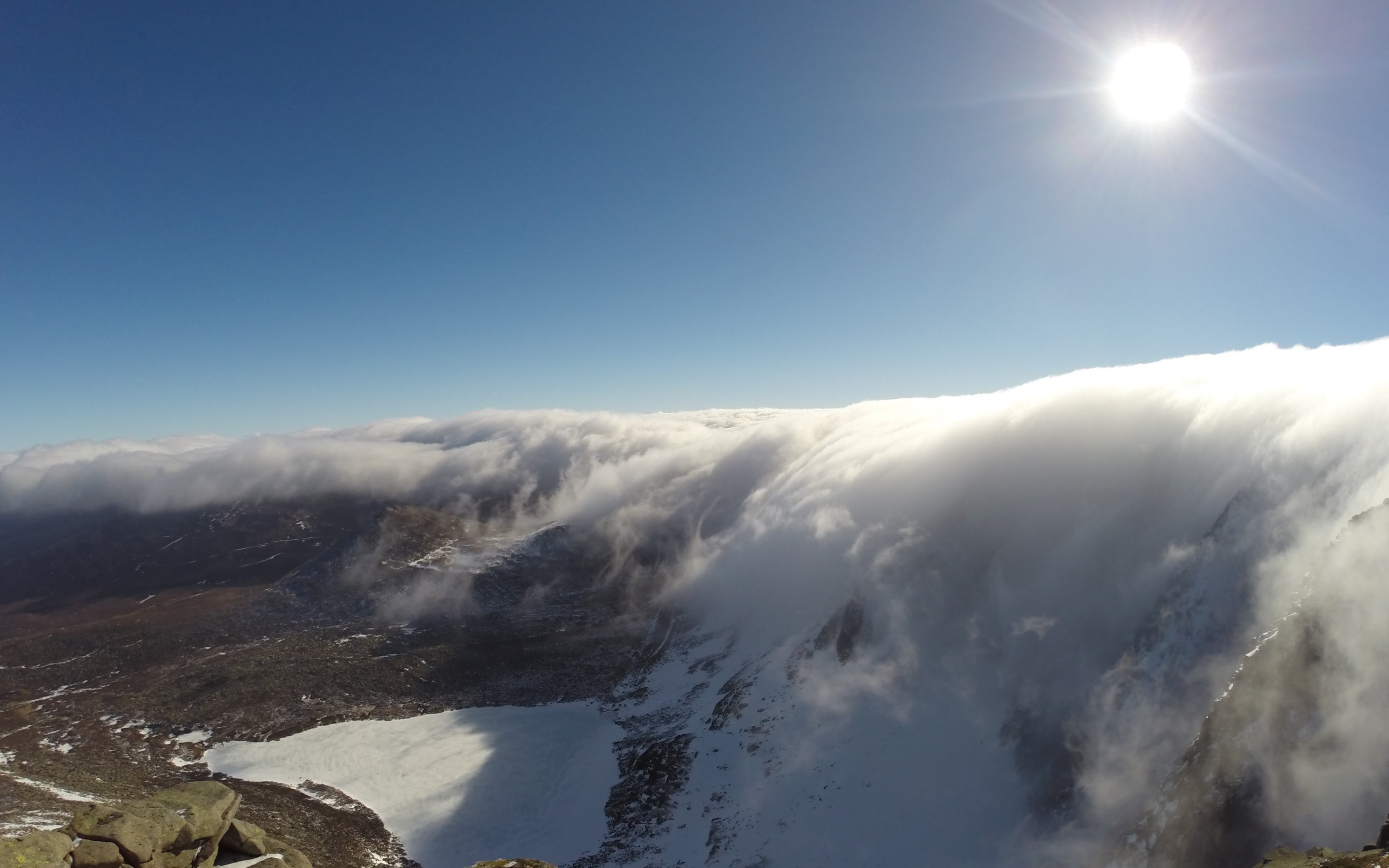 Sunlit clouds over snowy mountain landscape HD Wallpaper
