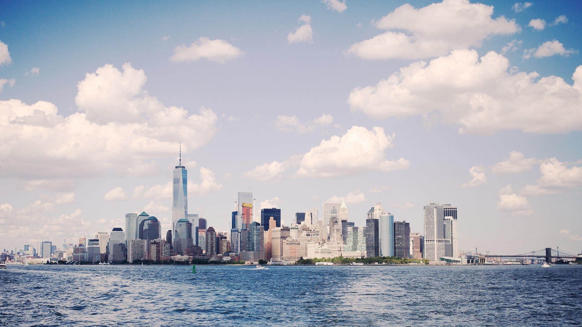 New York City skyline with One World Trade Center over the water HD Wallpaper