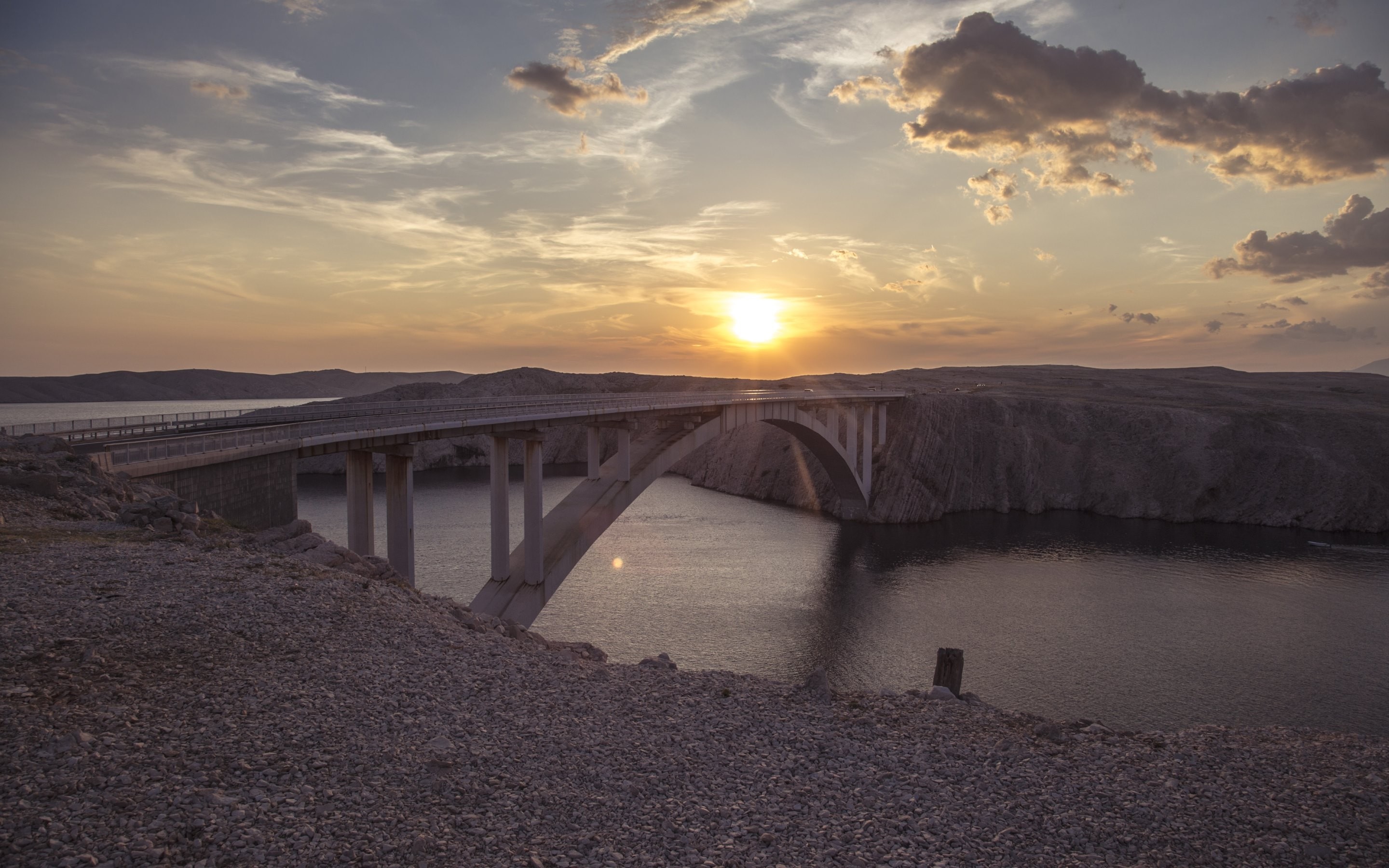 Bridge over water at sunset HD Wallpaper