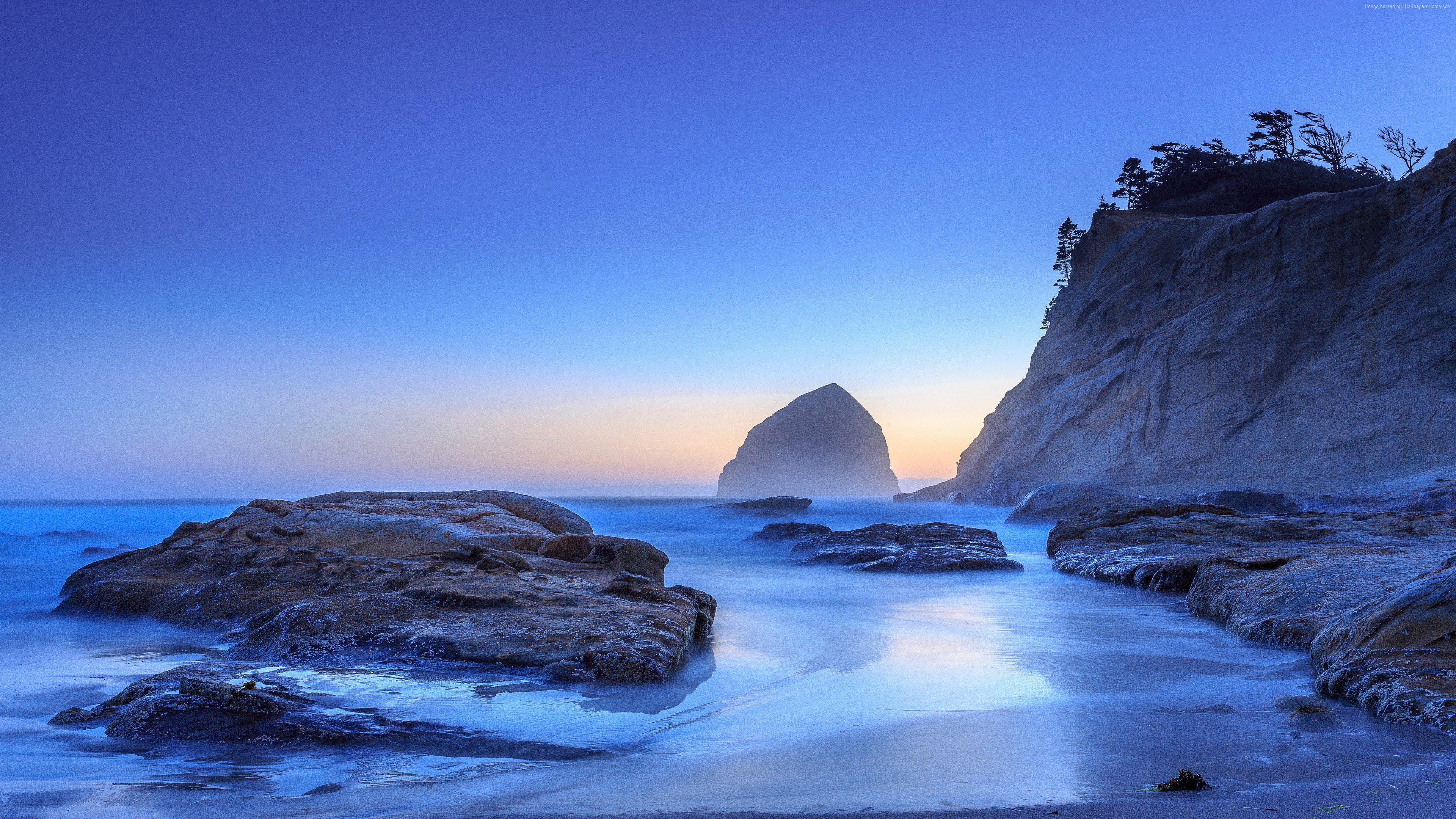 Ocean sunset with rock formations and cliffs HD Wallpaper