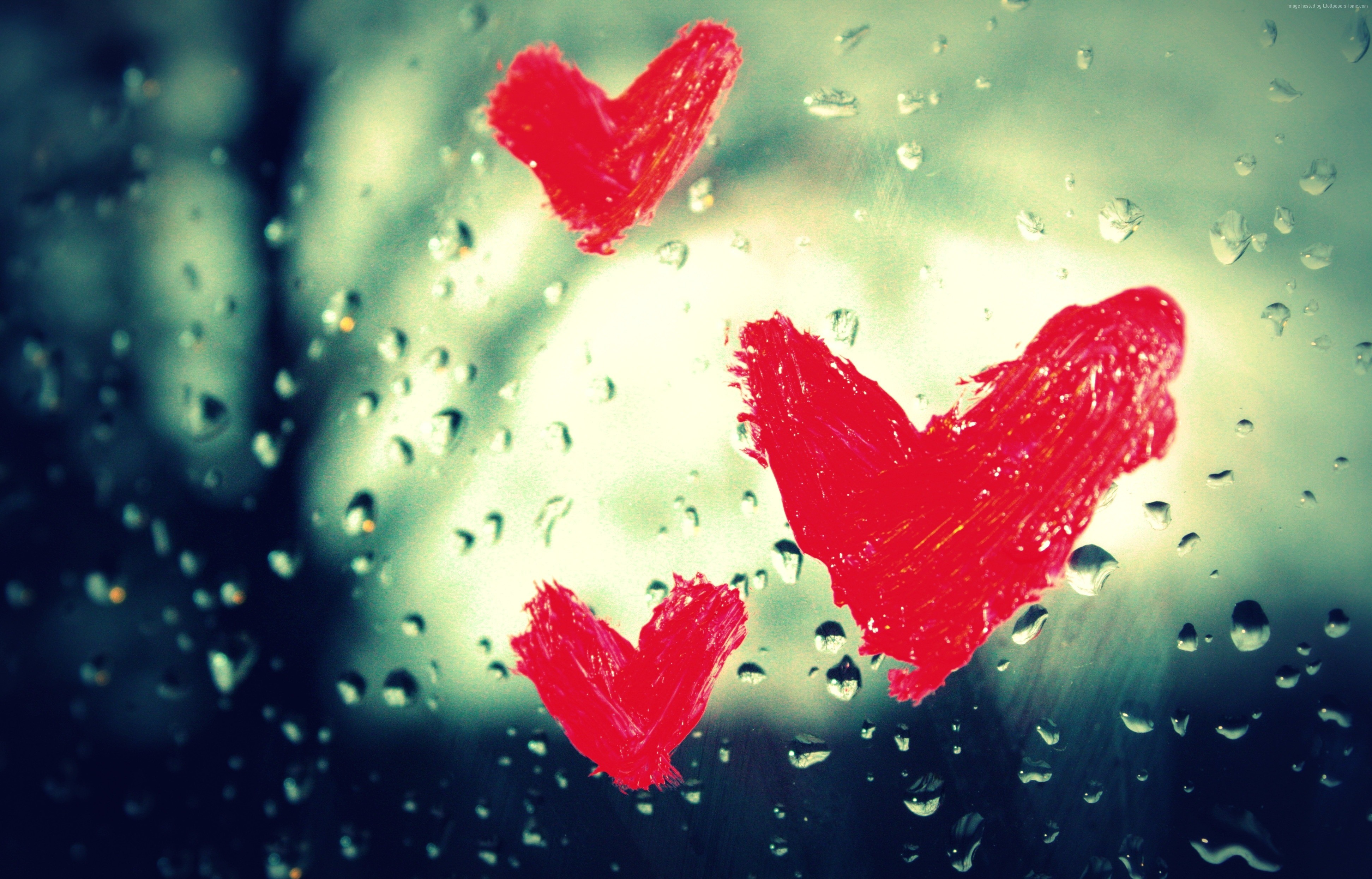 Red hearts painted on a wet window HD Wallpaper