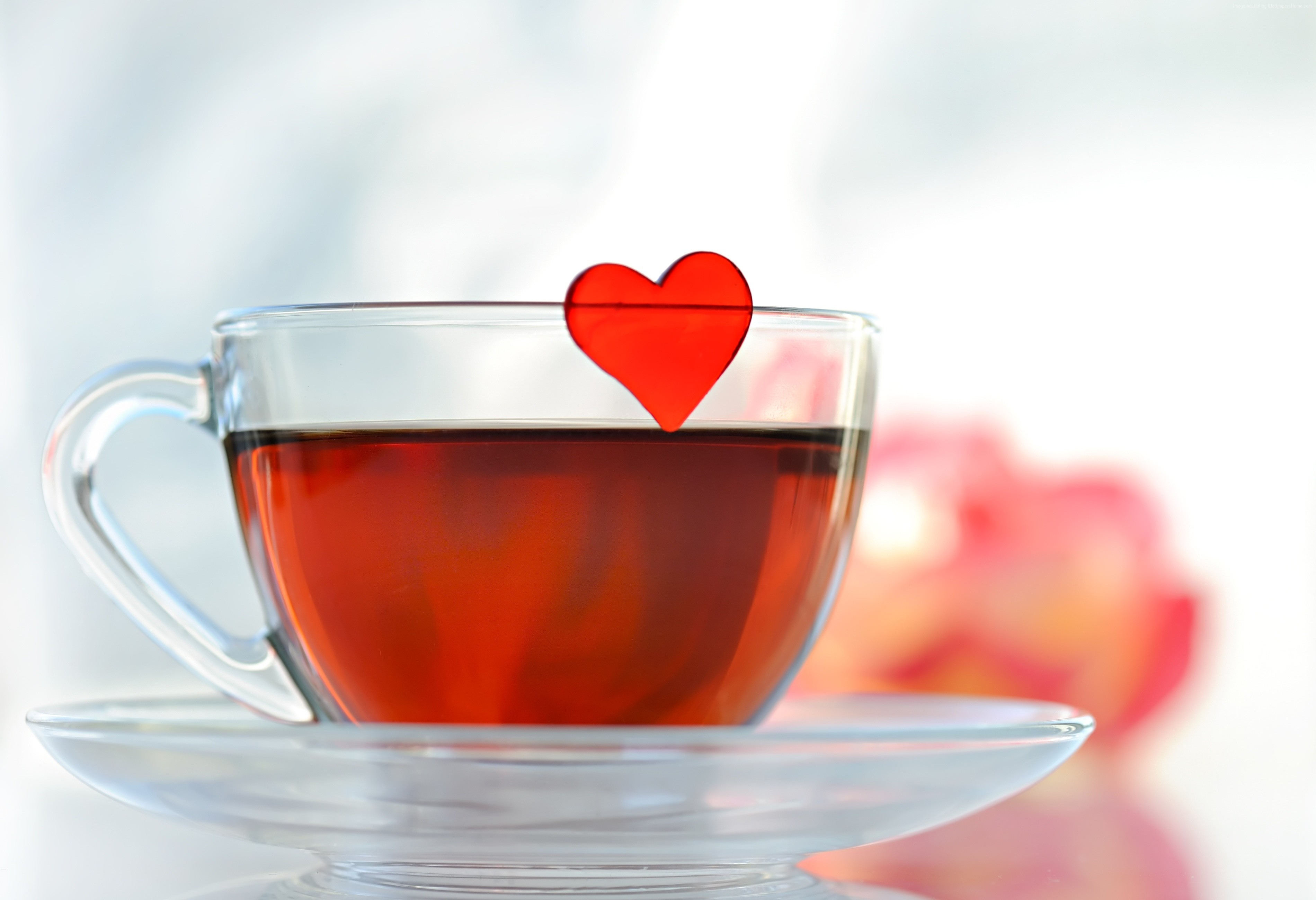 Cup of tea with a red heart decoration HD Wallpaper