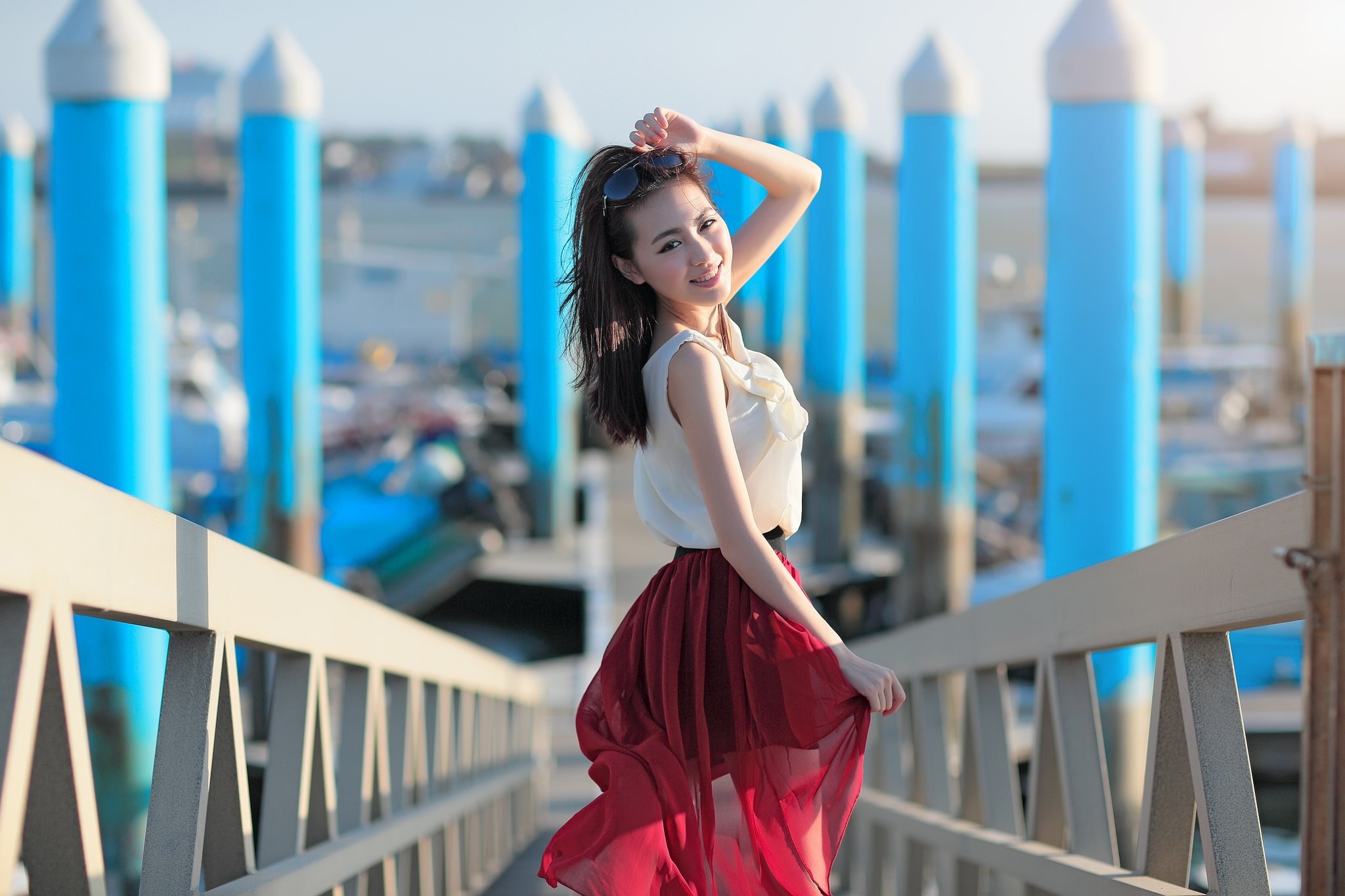 Asian woman in a white top and red skirt on a pier HD Wallpaper