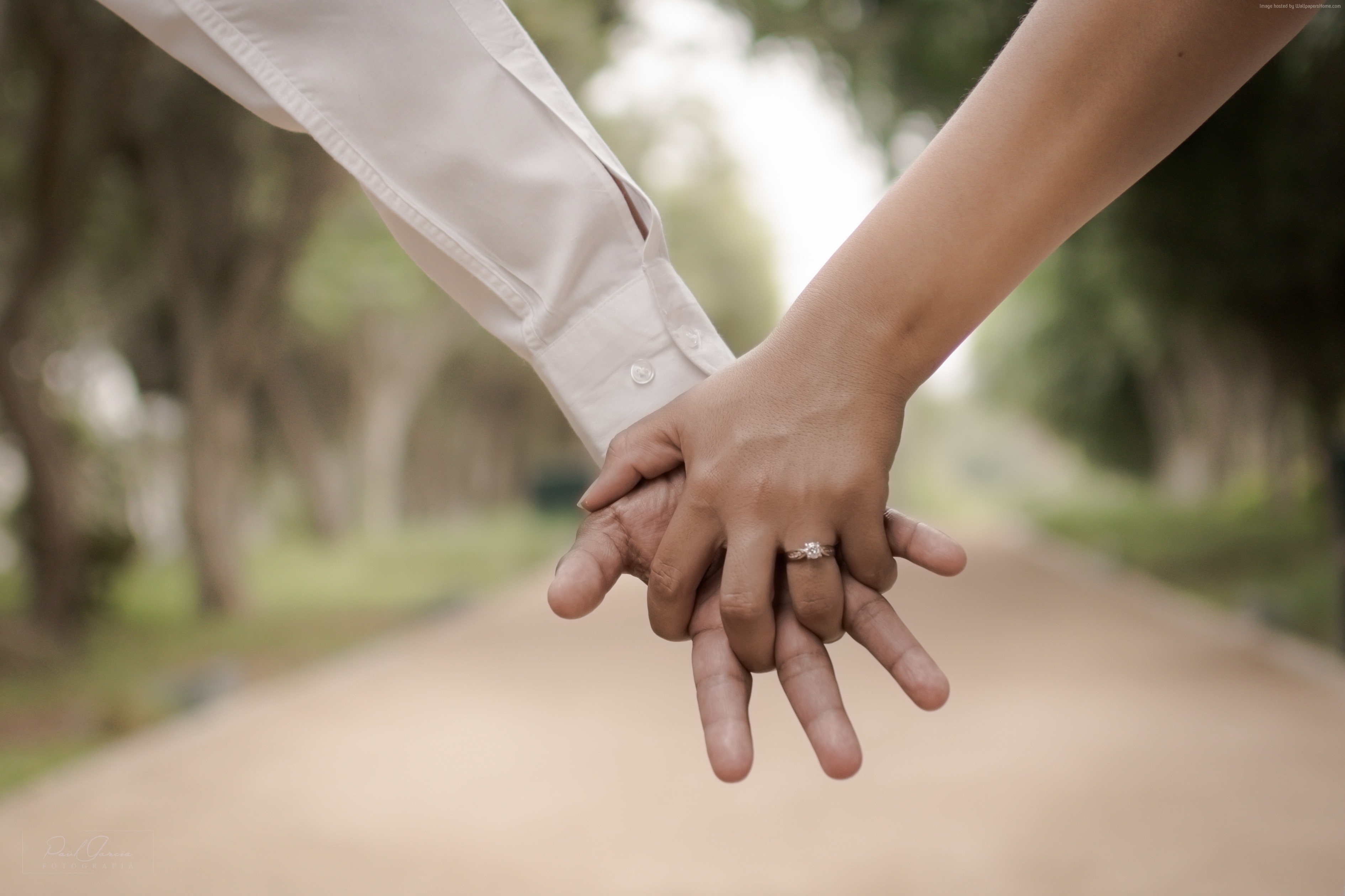 Couple holding hands with engagement ring HD Wallpaper