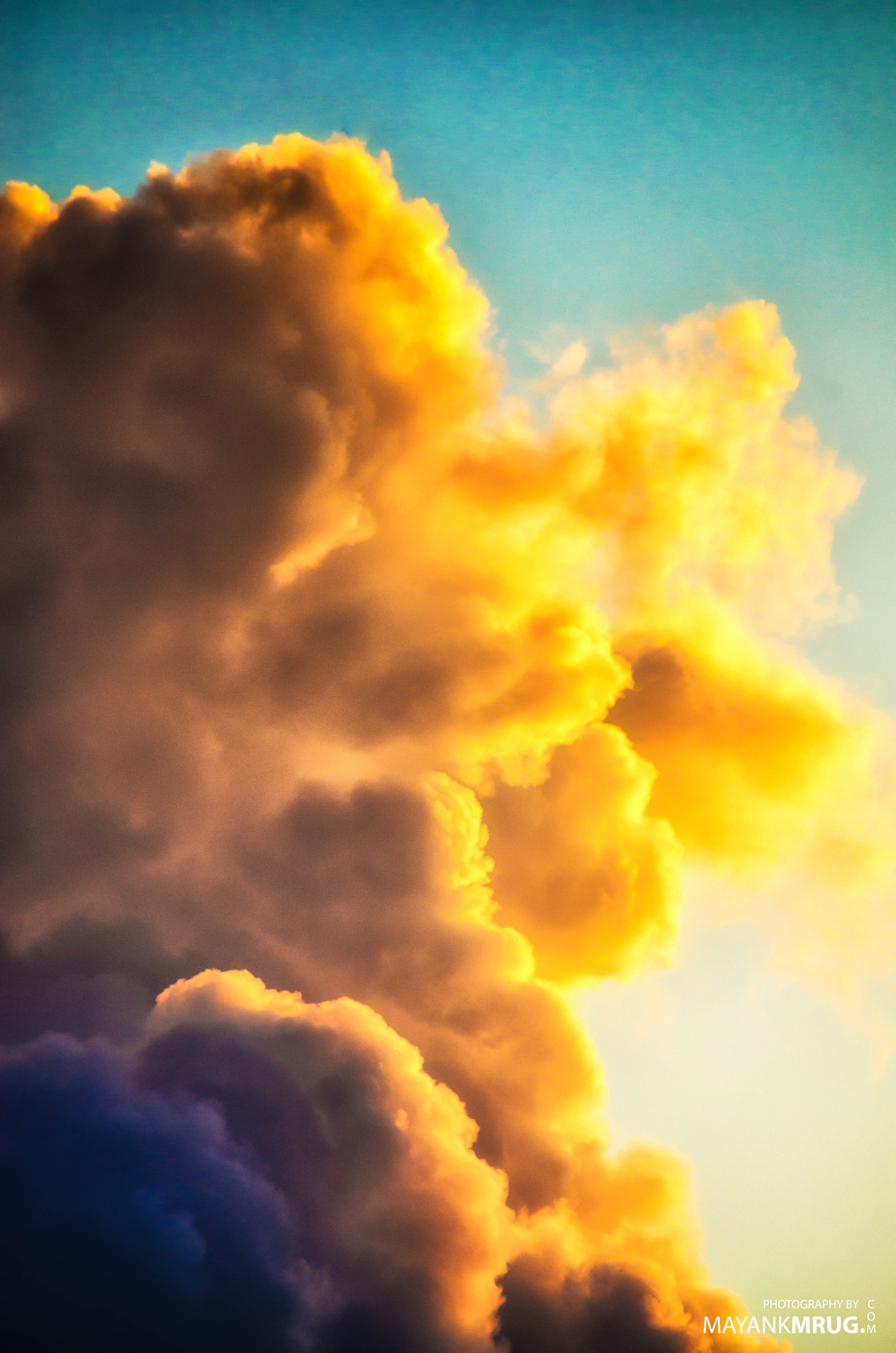 Golden and dark clouds in the sky at sunset HD Wallpaper