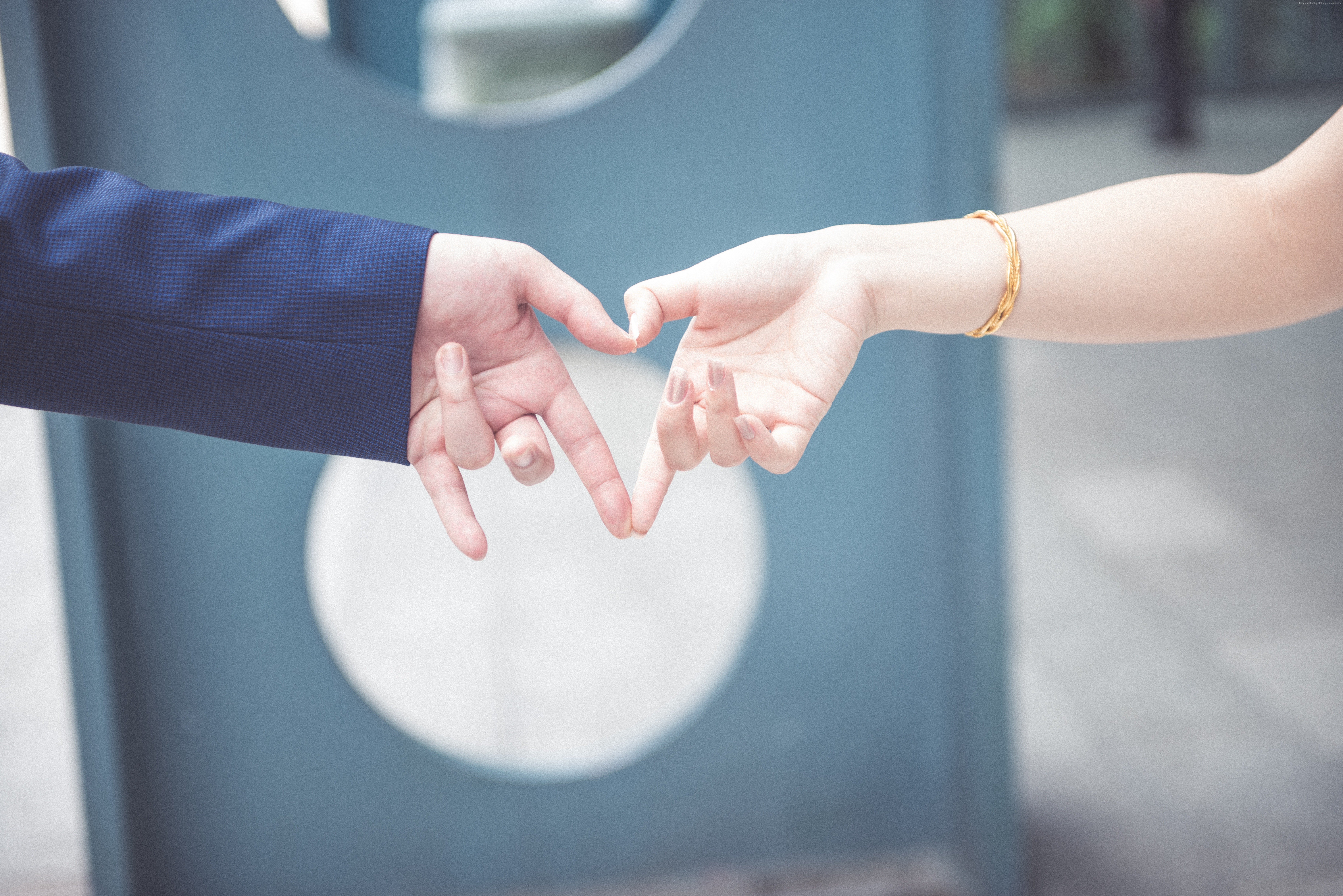 Couple making heart shape with hands HD Wallpaper