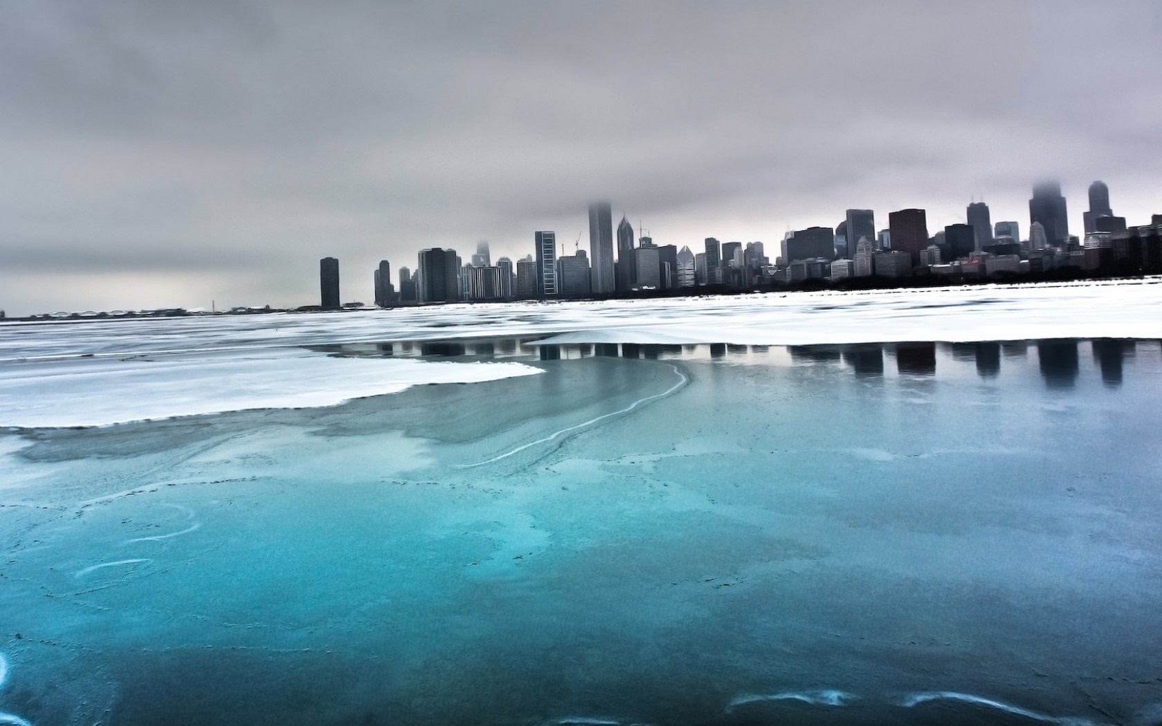 Frozen Lake Reflecting City Skyline Under Cloudy Sky HD Wallpaper