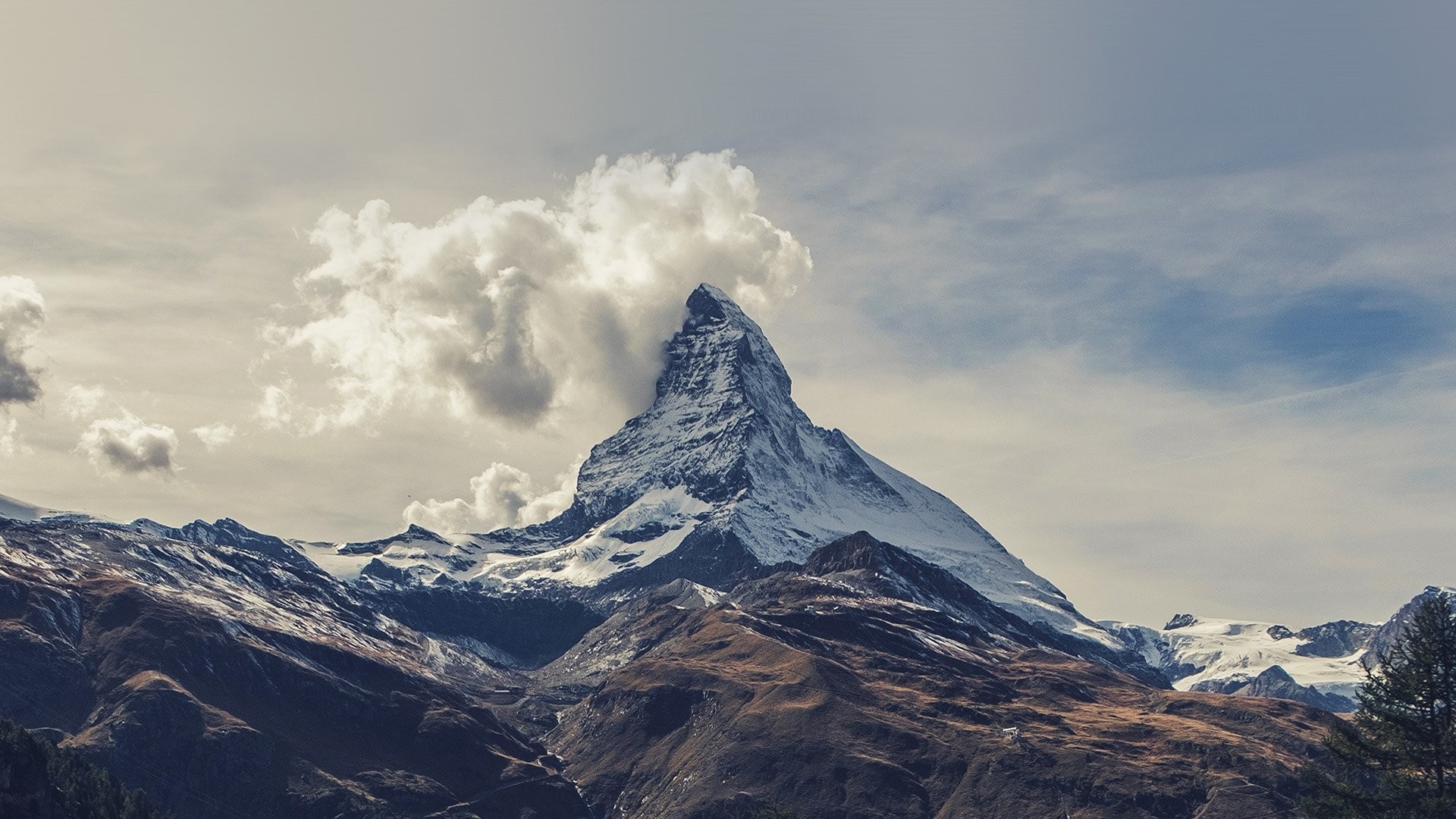 The Matterhorn mountain with clouds in the Alps HD Wallpaper