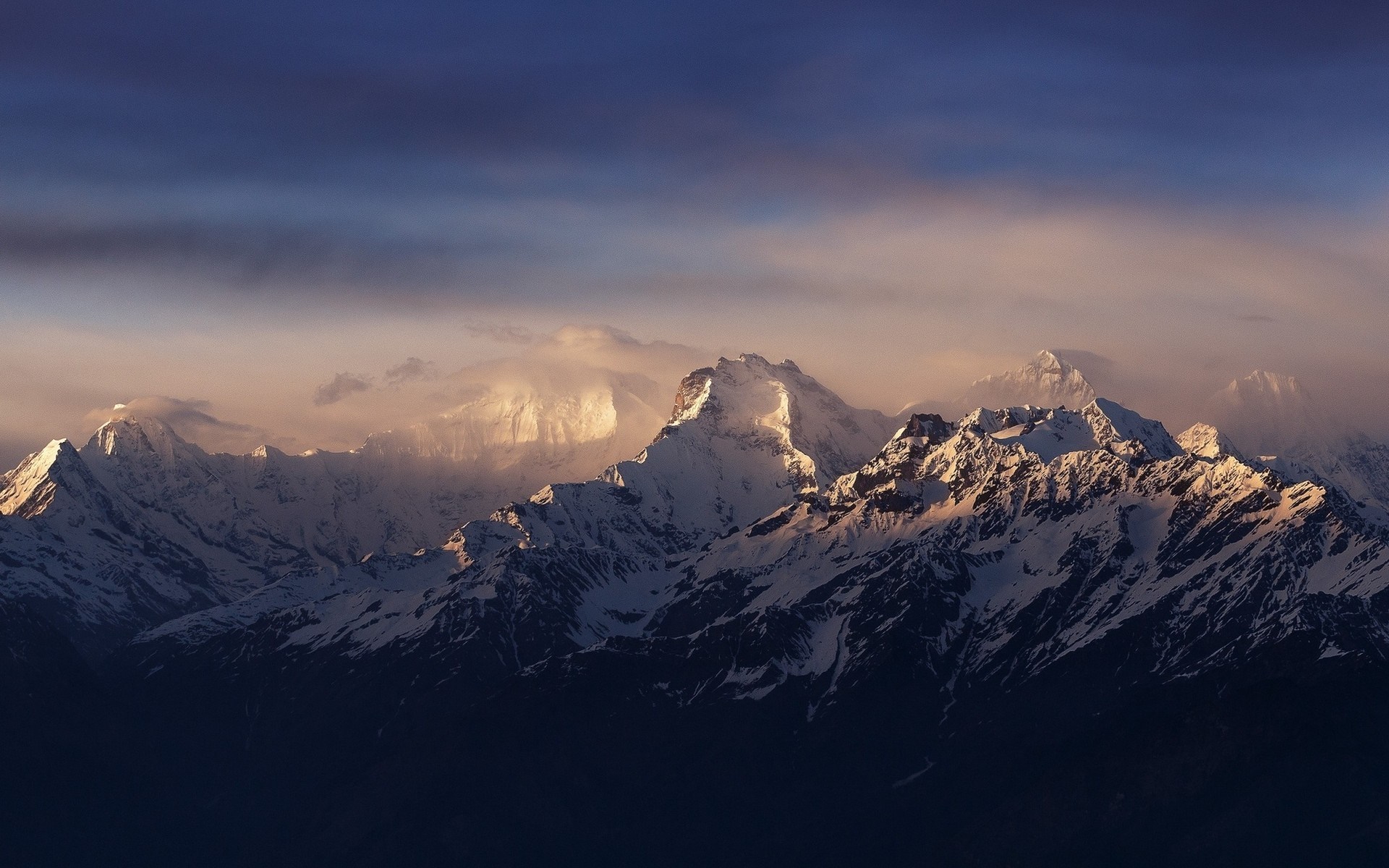 Snow-capped mountains at sunset with clouds HD Wallpaper