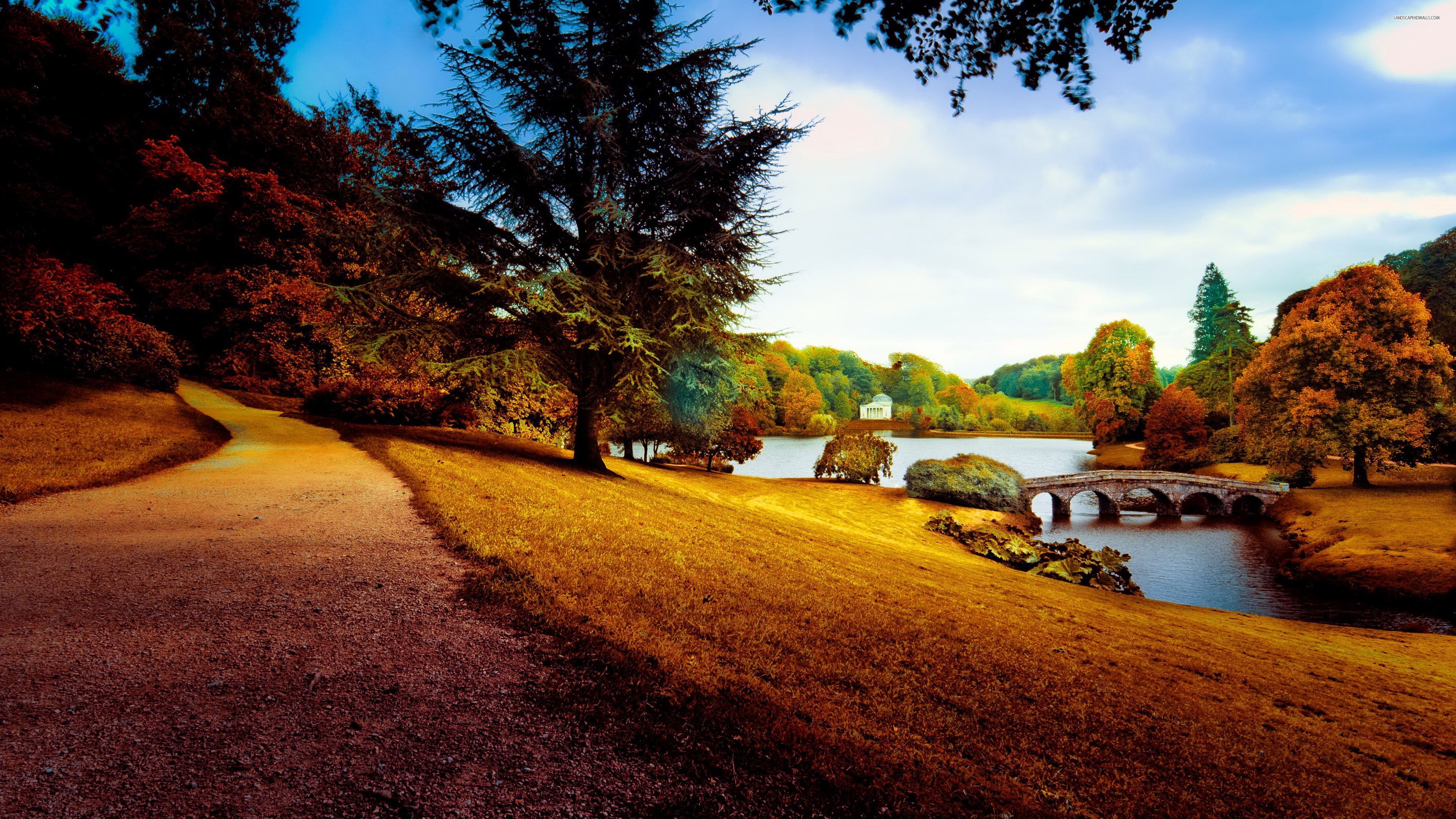 Autumn landscape with a stone bridge over a lake HD Wallpaper