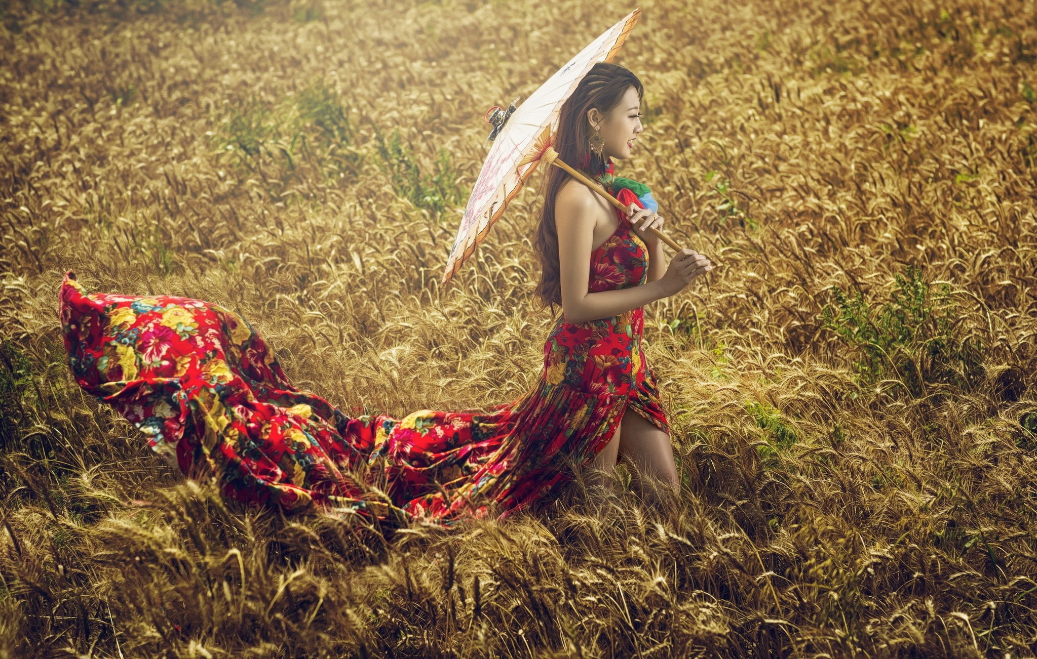 Woman in floral dress holding umbrella in wheat field HD Wallpaper