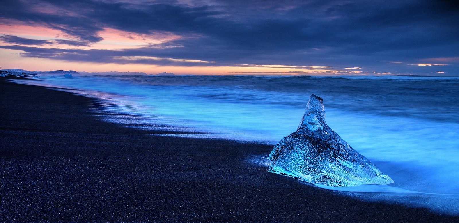 Ice on black sand beach at dusk in Iceland HD Wallpaper