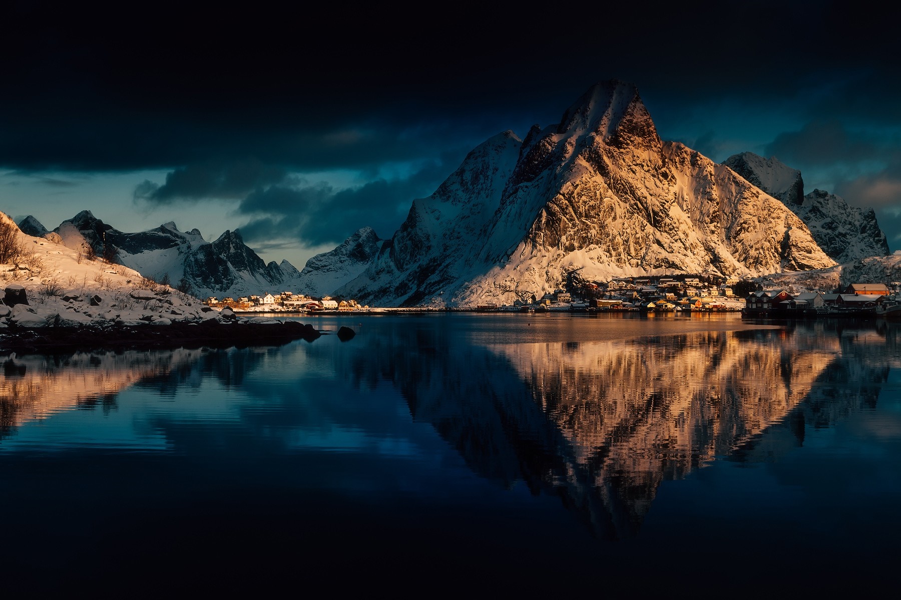 Snowy mountains reflecting in water at sunset in Lofoten, Norway HD Wallpaper