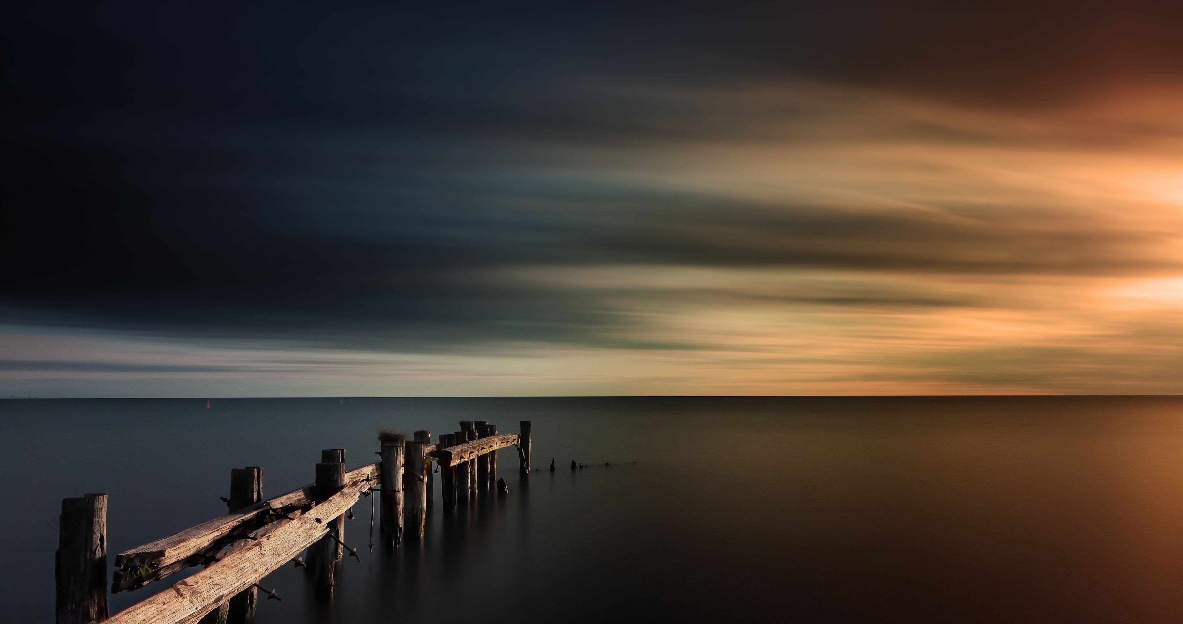 Wooden pier over the sea at sunset HD Wallpaper