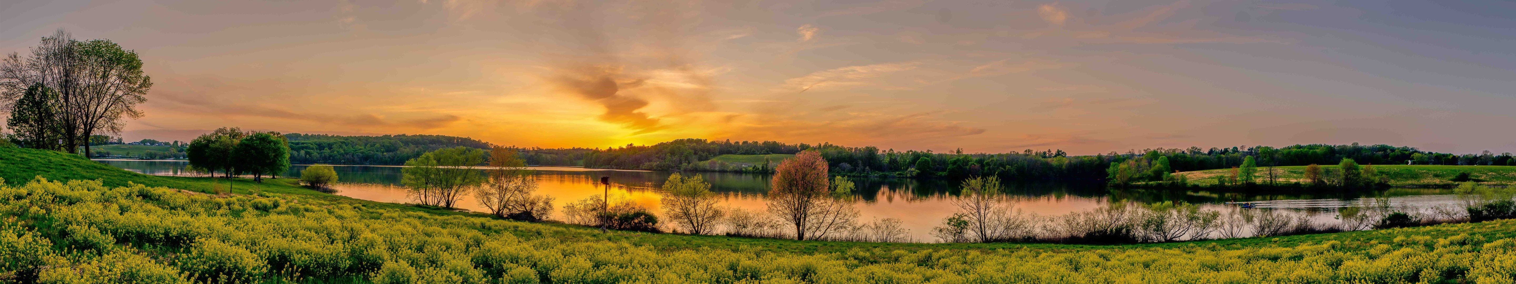Panoramic sunset over a lake with yellow fields HD Wallpaper