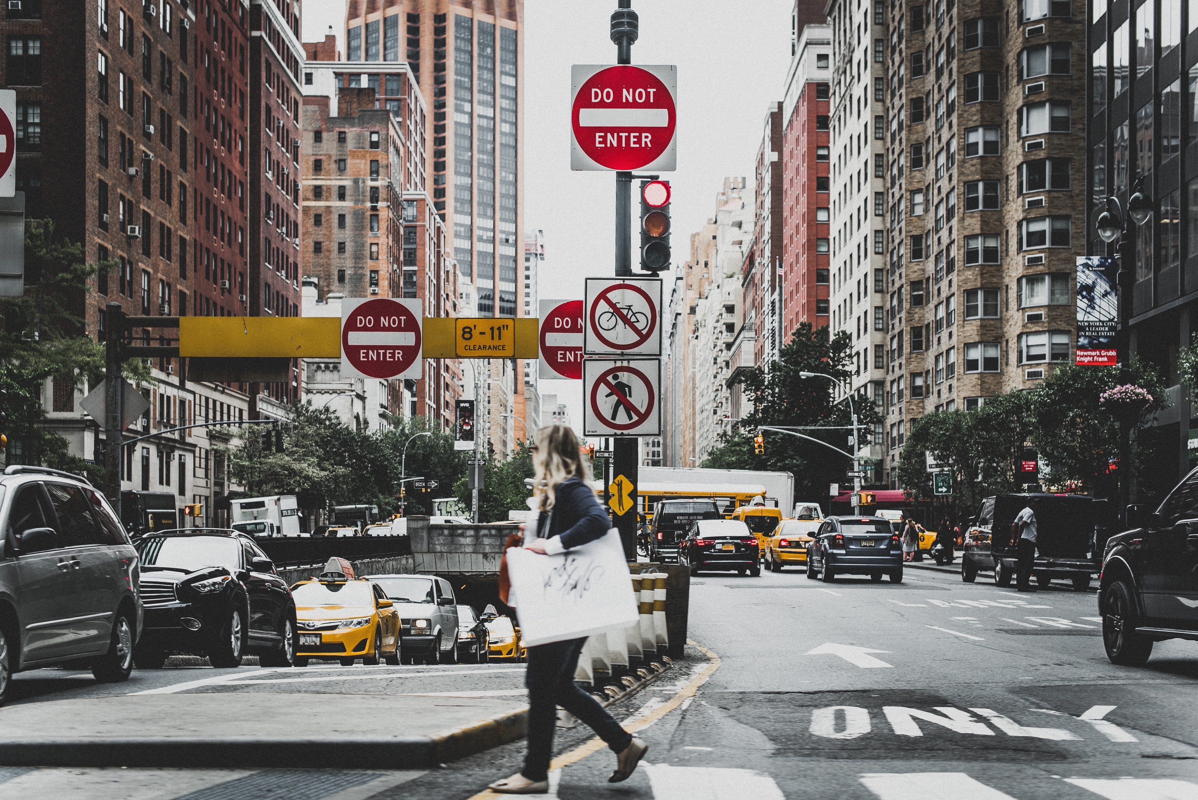 New York City street with traffic and signs HD Wallpaper