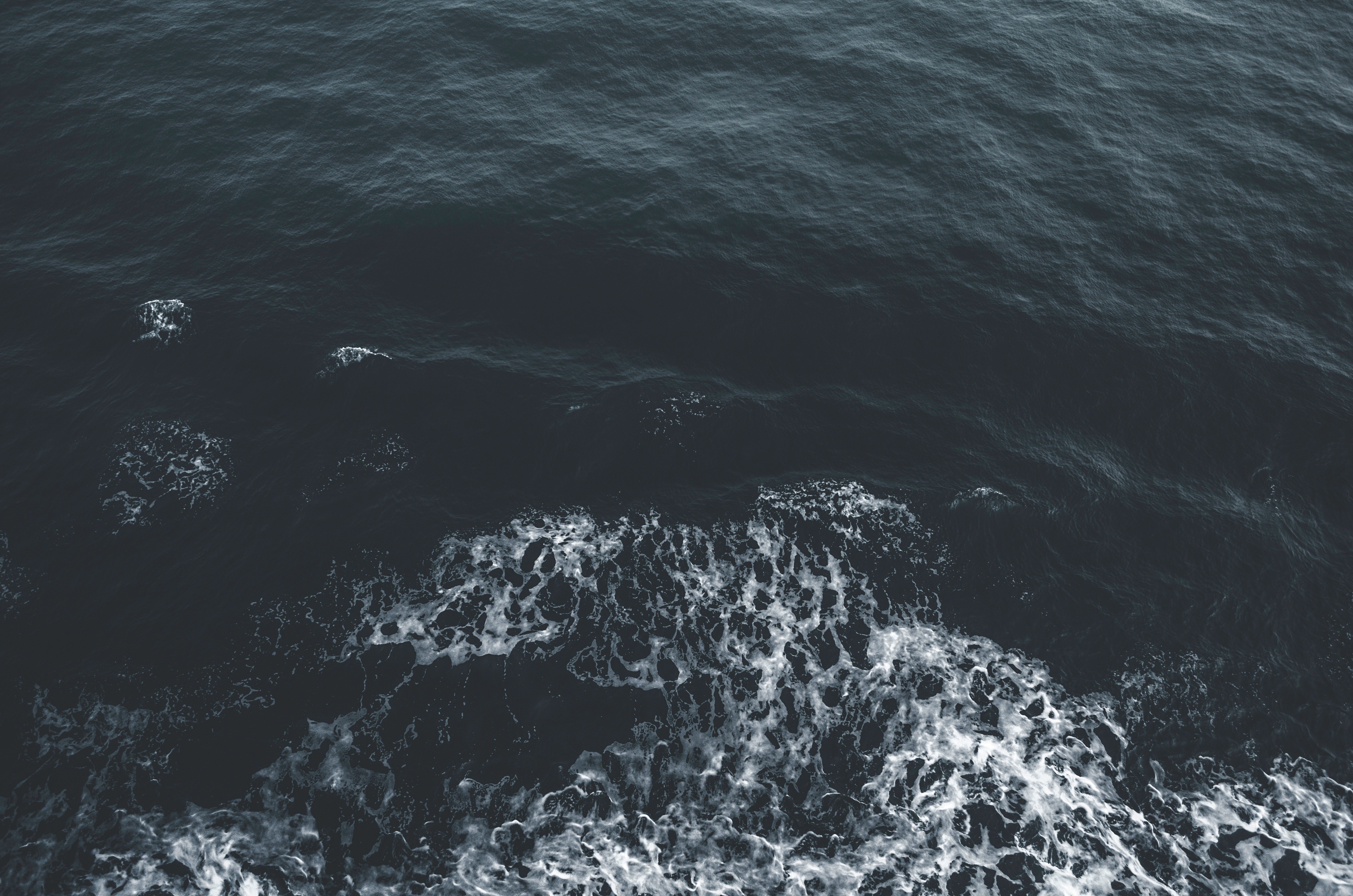Dark ocean waves with white foam HD Wallpaper
