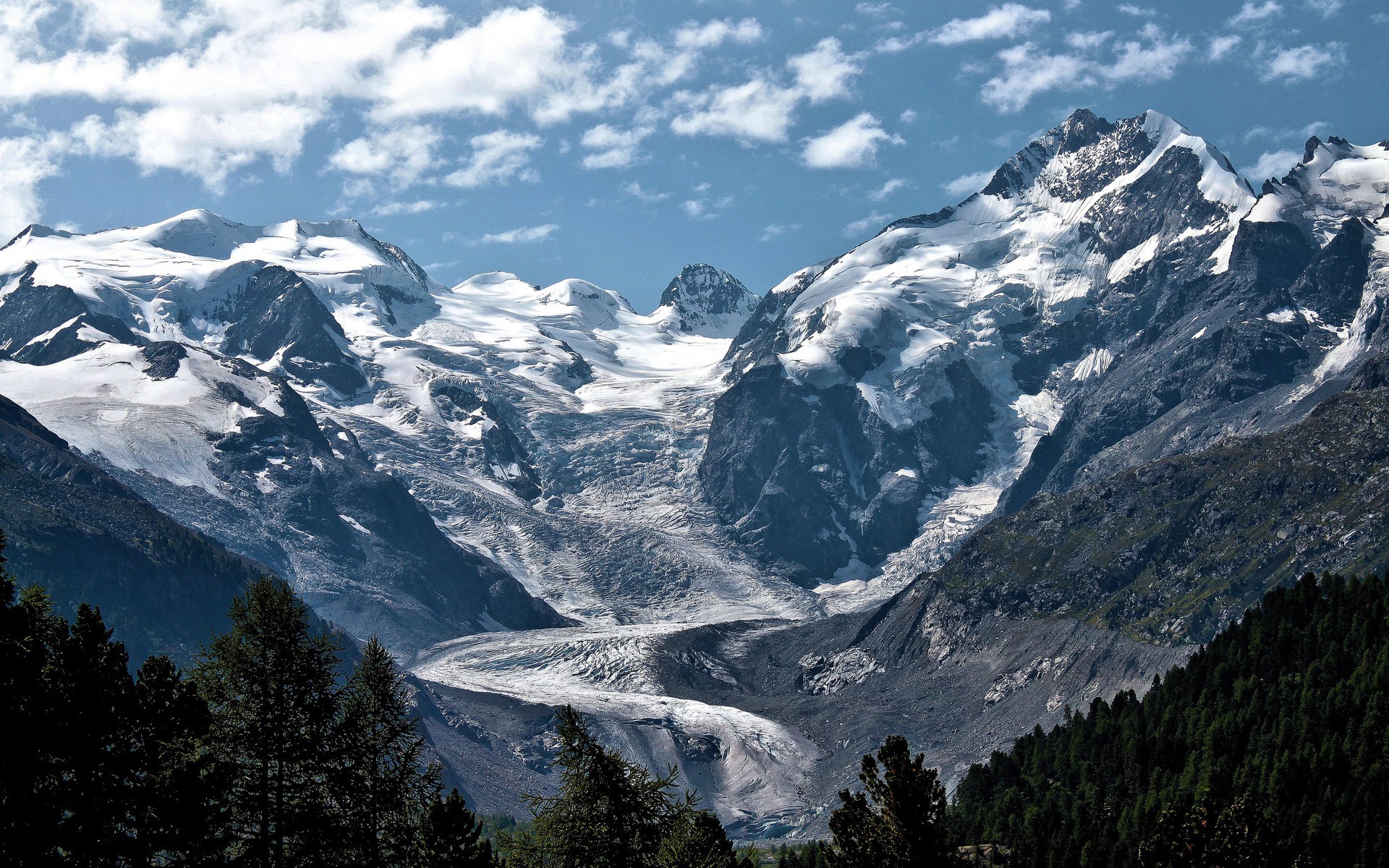Snow-capped mountains and a glacier under a blue sky HD Wallpaper
