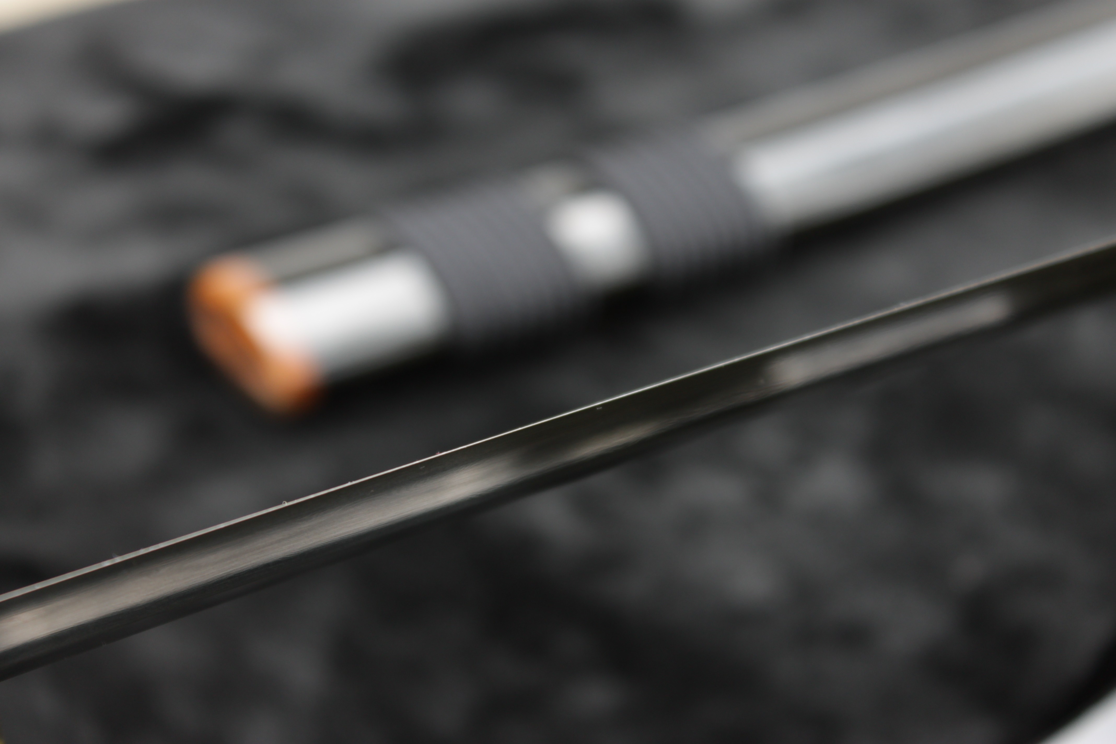 Close-up of a katana sword blade and handle HD Wallpaper