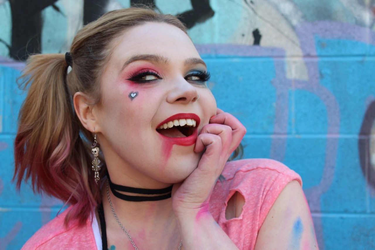 Woman with Harley Quinn makeup and pink shirt HD Wallpaper