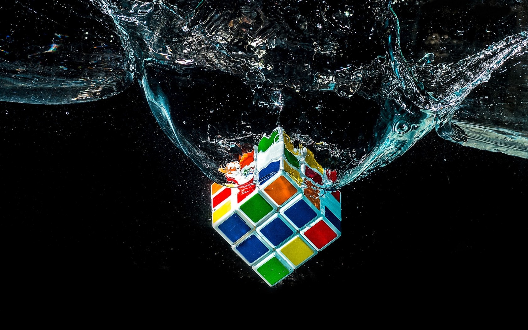 Rubik's Cube splashing into water HD Wallpaper