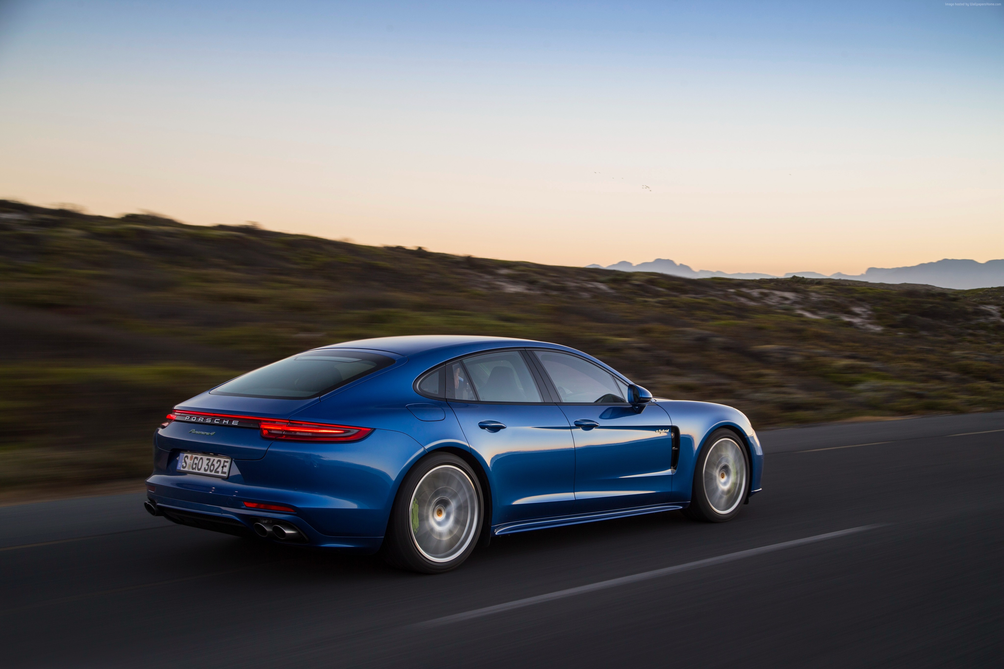 Blue Porsche Panamera 4 E-Hybrid driving on road HD Wallpaper