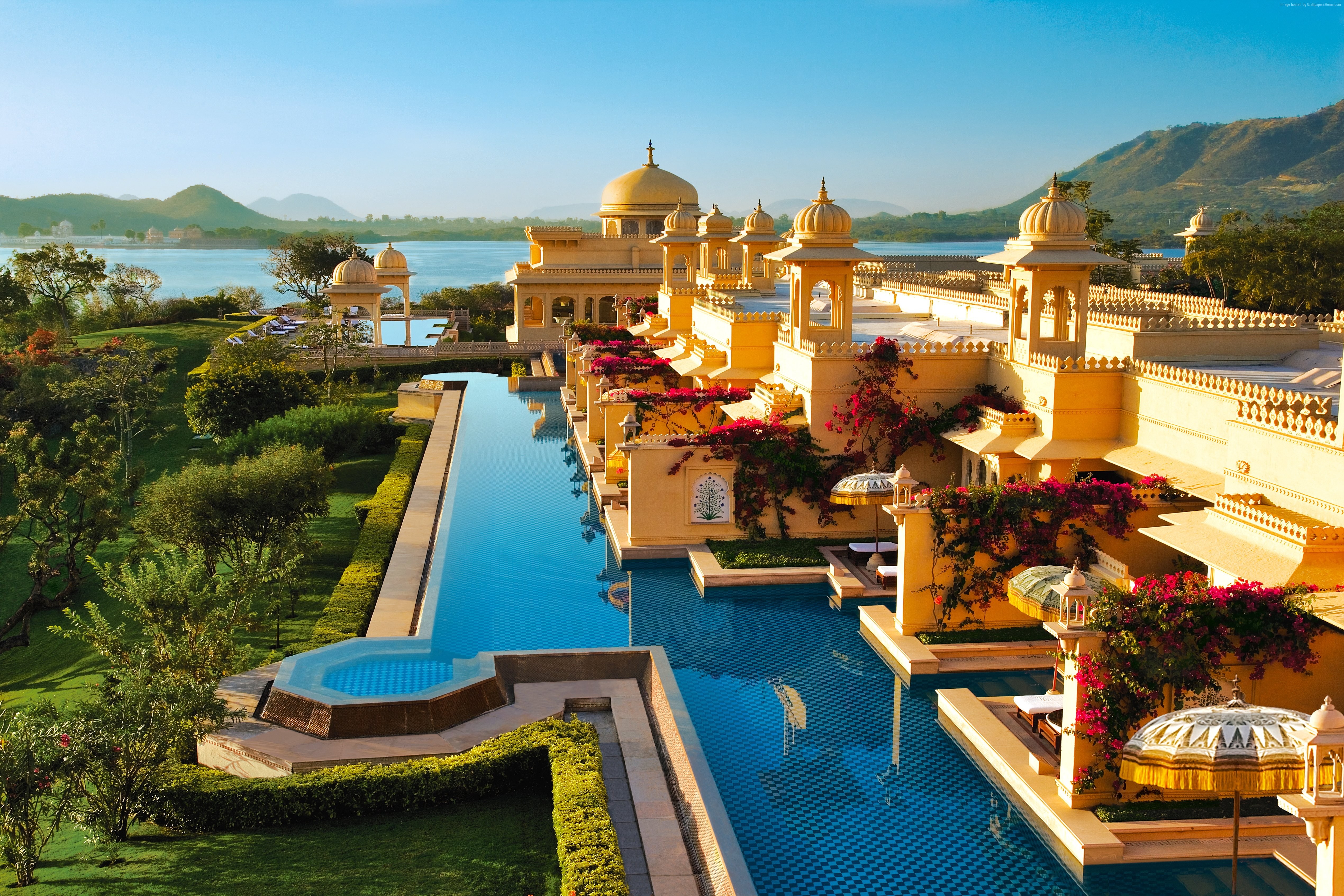 Luxury hotel with infinity pool overlooking a lake in India HD Wallpaper