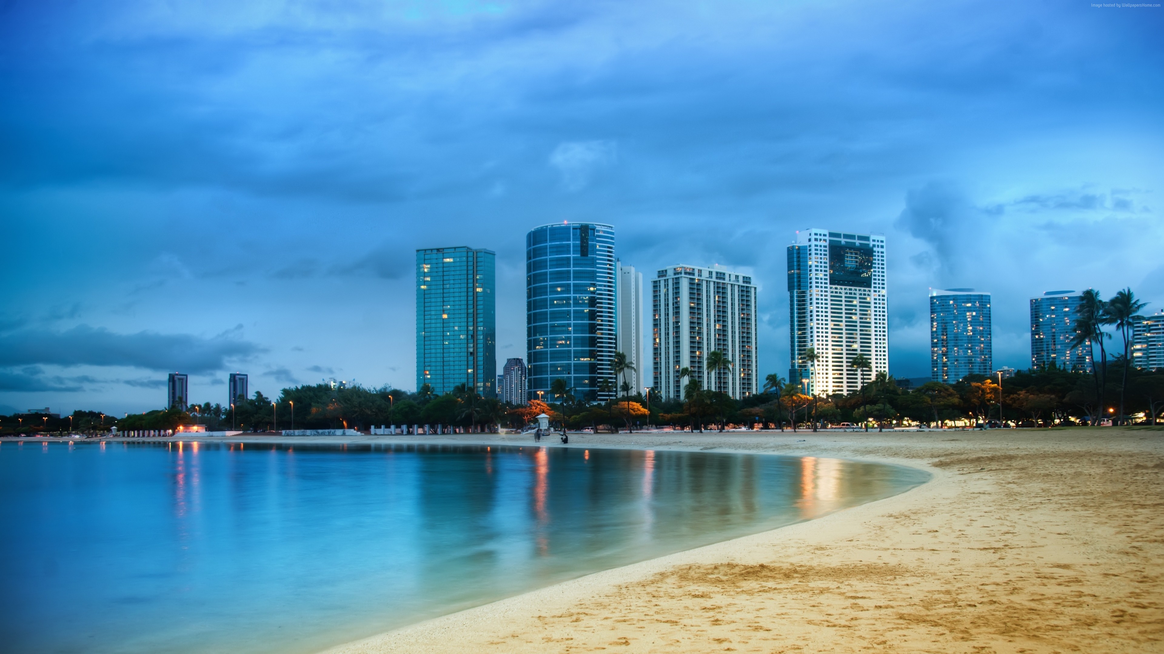 City skyline with beach and ocean at dusk HD Wallpaper