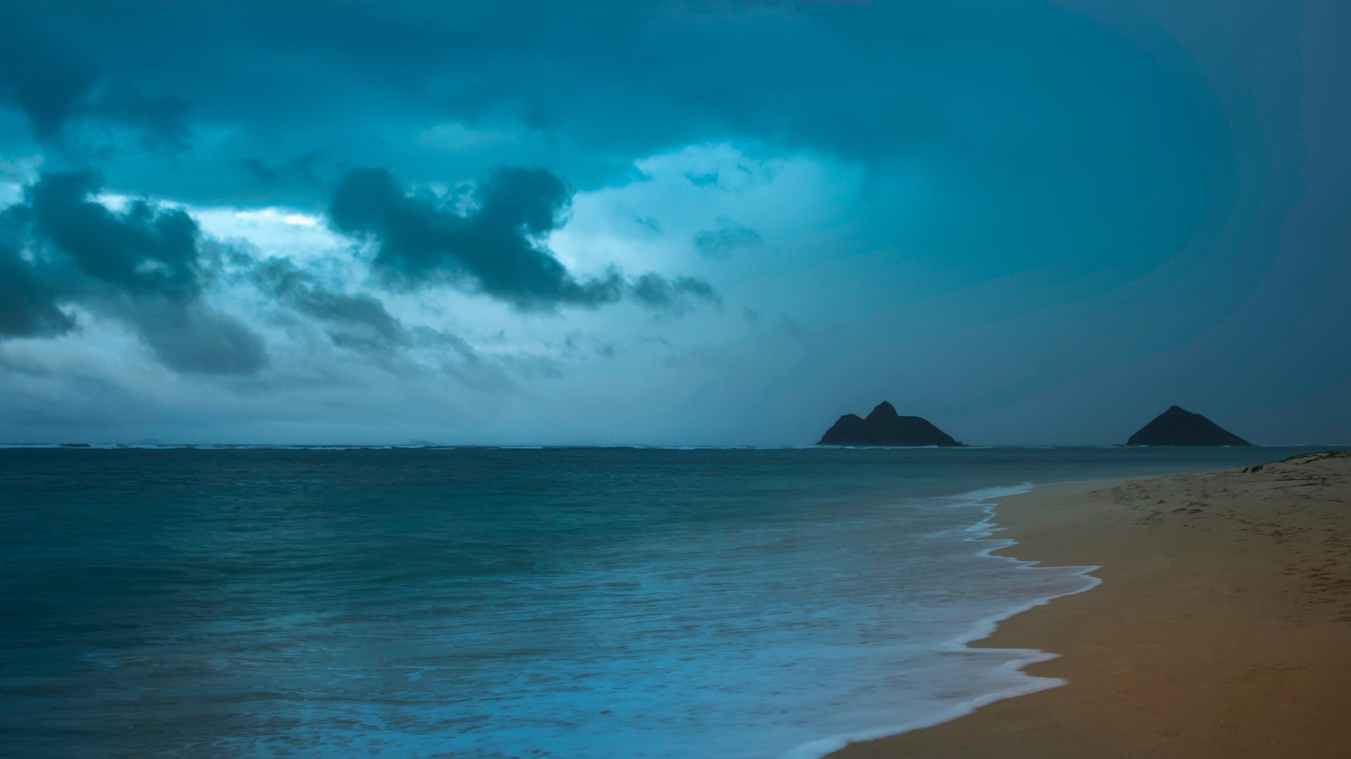 Two islands in the ocean under stormy clouds HD Wallpaper