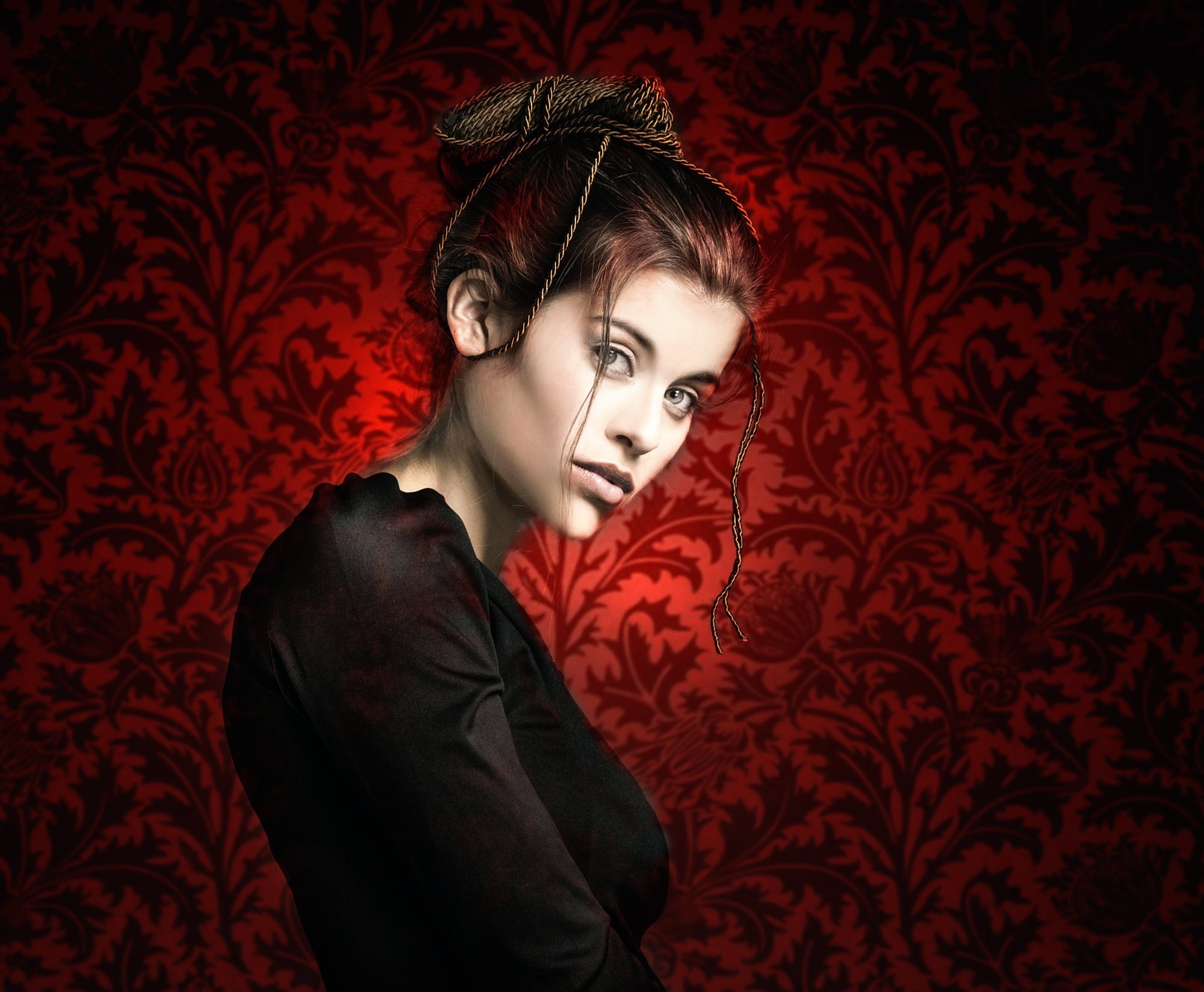 Woman with hair bun against red damask wallpaper HD Wallpaper