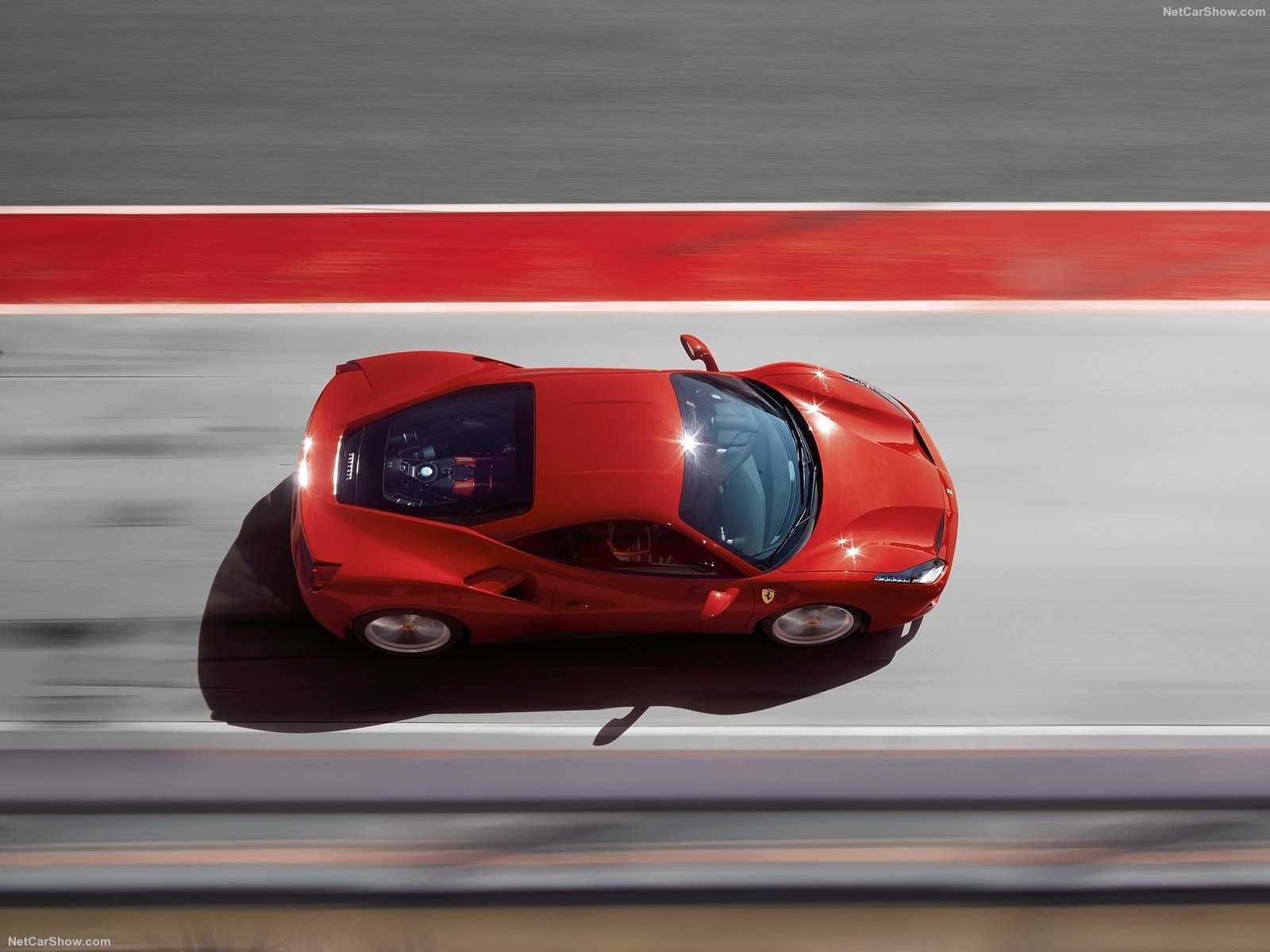 Red Ferrari 488 GTB driving on a race track HD Wallpaper