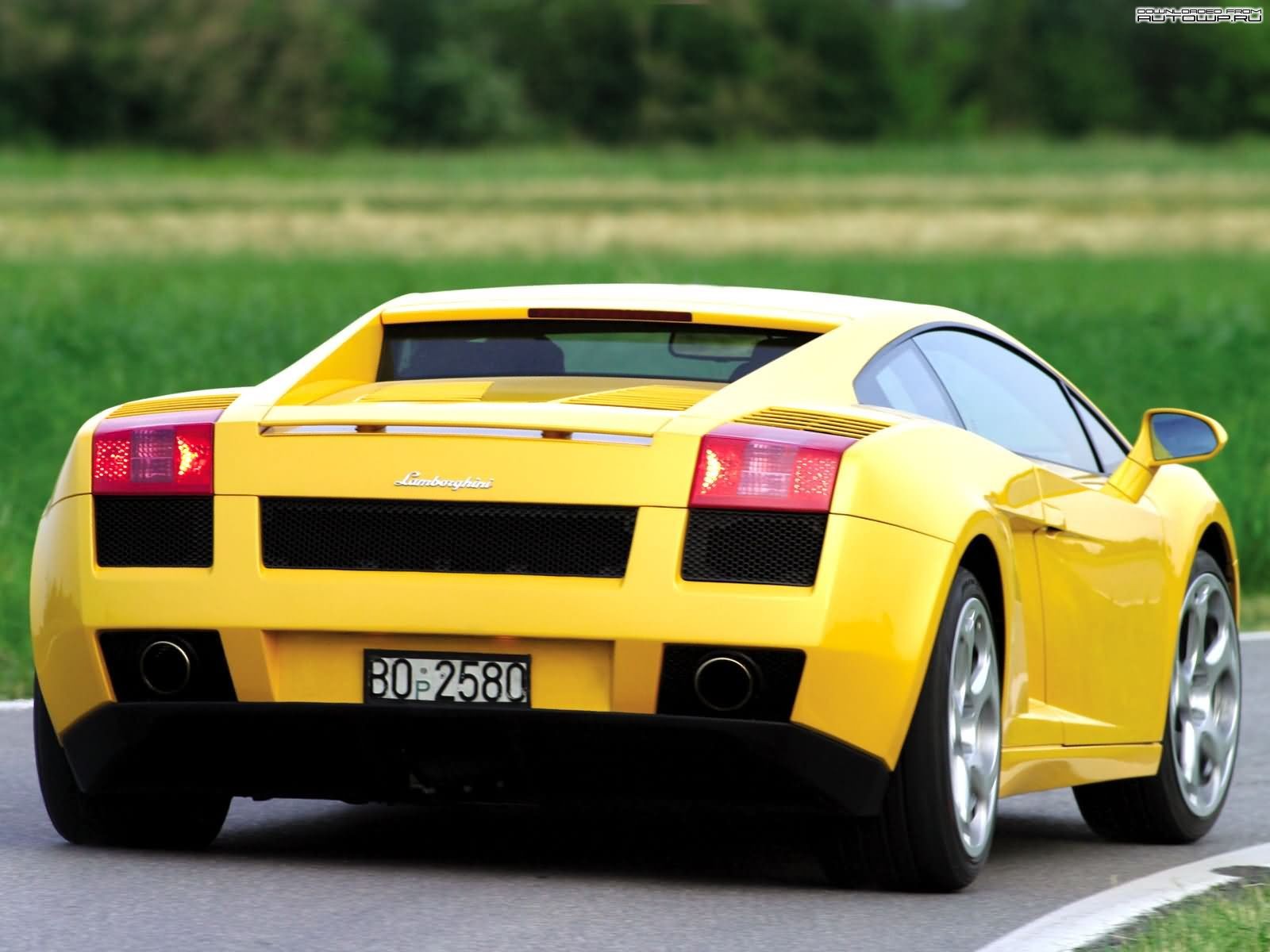 Yellow Lamborghini Gallardo parked on a road HD Wallpaper