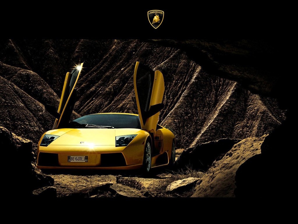 Yellow Lamborghini with Scissor Doors in Rocky Terrain HD Wallpaper