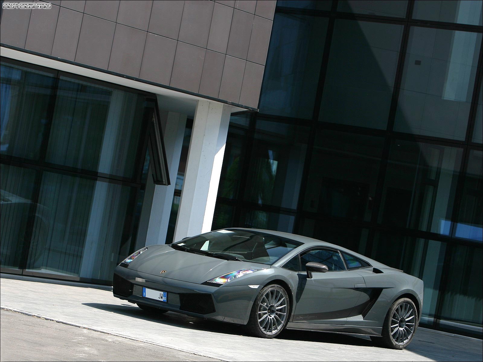 Gray Lamborghini Gallardo parked in front of a modern building HD Wallpaper