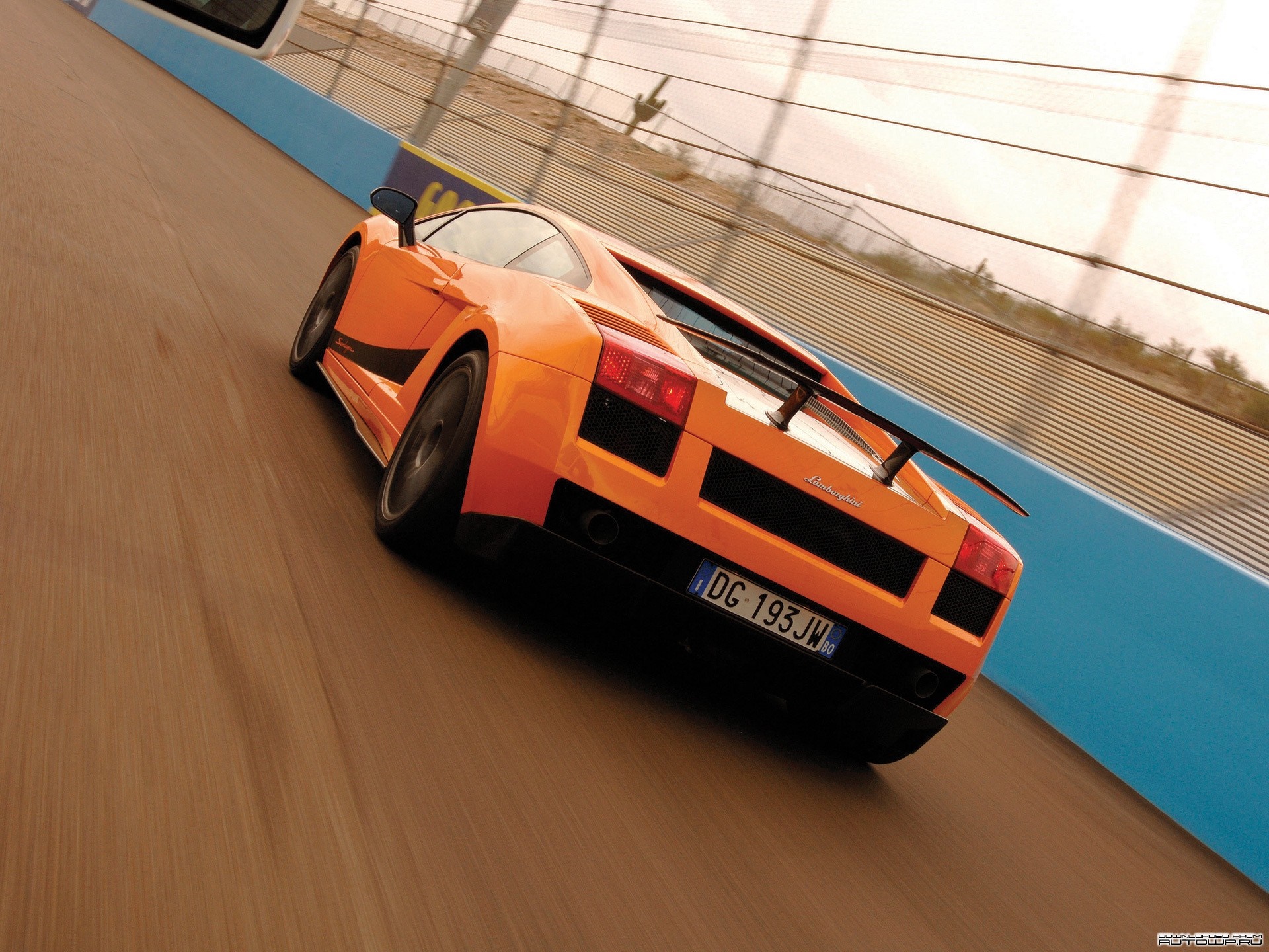 Orange Lamborghini Gallardo on a Racetrack HD Wallpaper