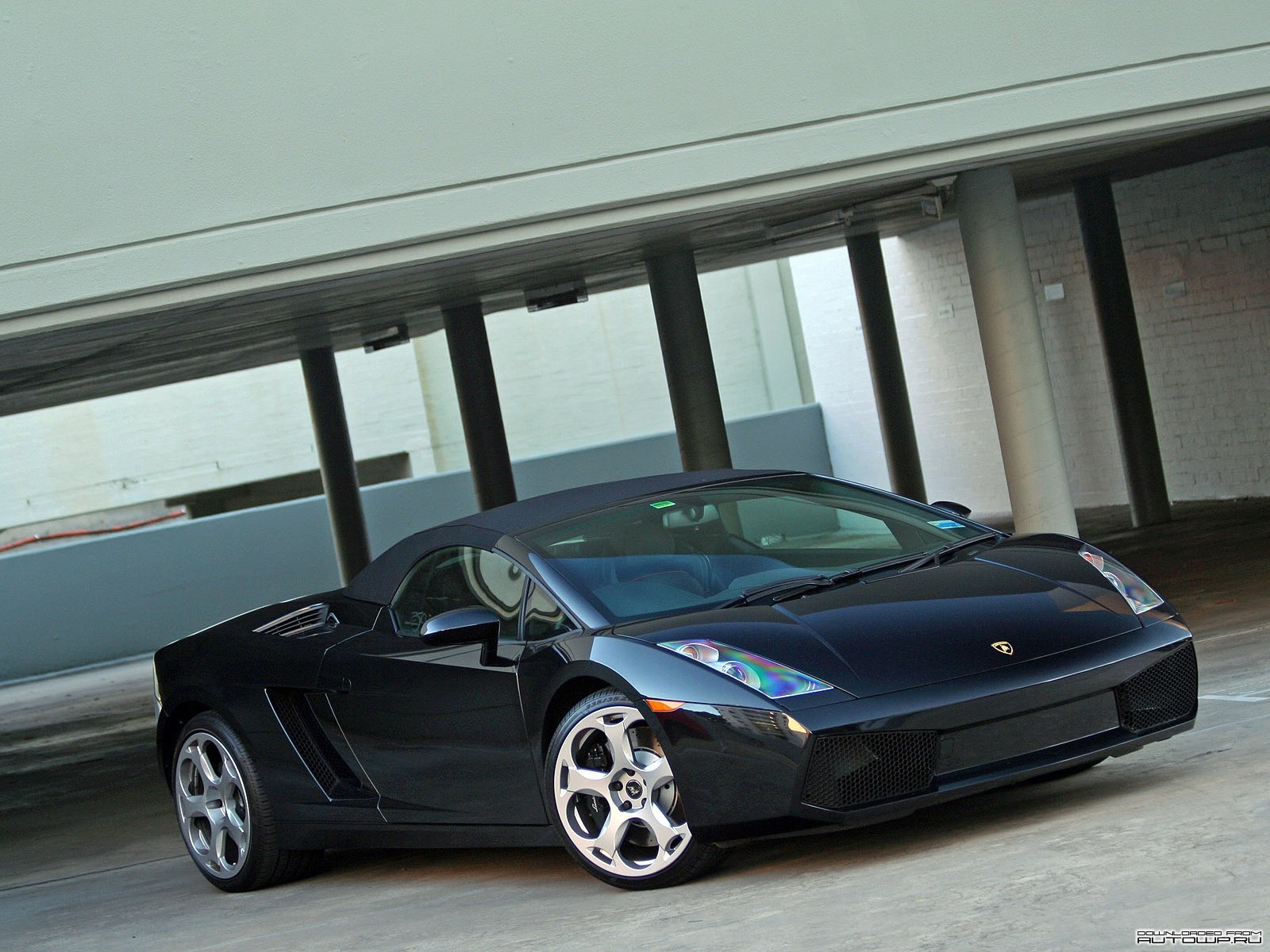 Black Lamborghini Gallardo Spyder parked under a structure HD Wallpaper