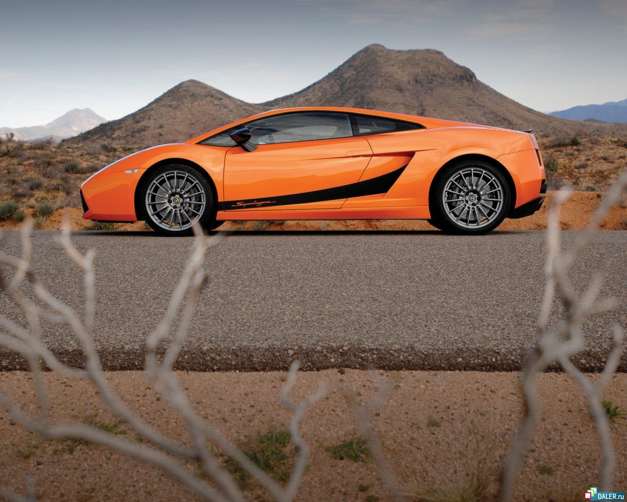 Orange Lamborghini Gallardo Super Trofeo Stradale on a desert road HD Wallpaper