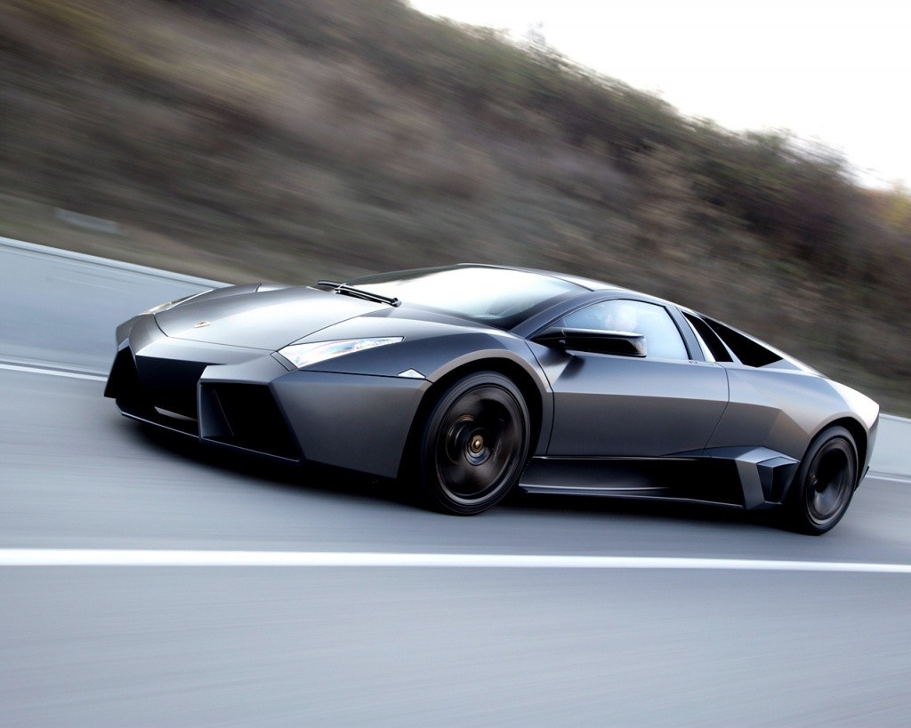 Lamborghini Reventon driving on a road HD Wallpaper