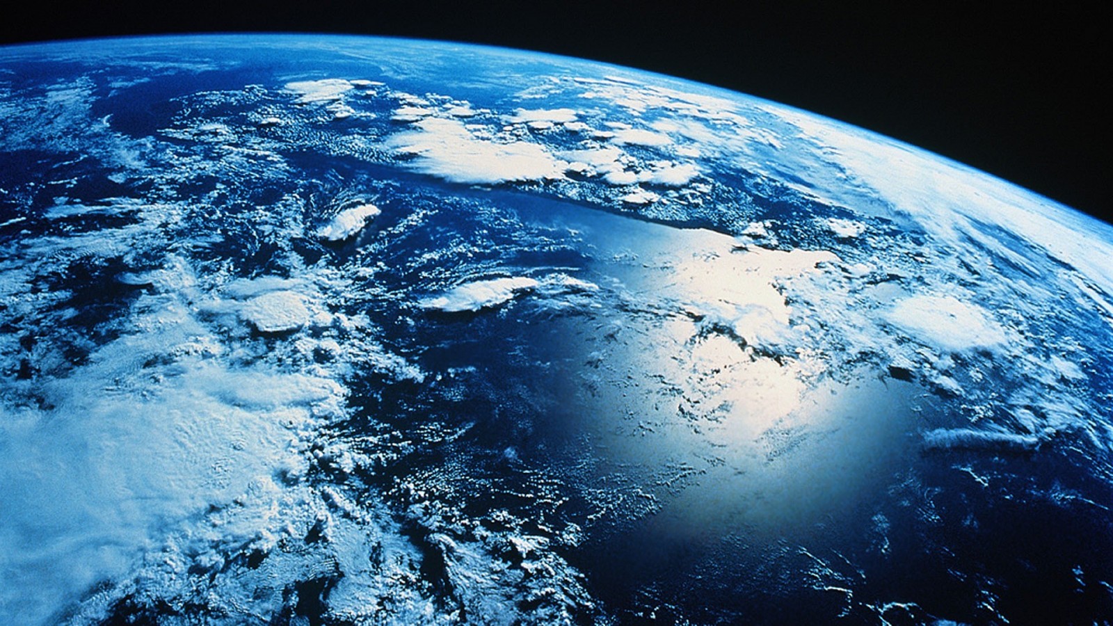 Earth from space with clouds and oceans HD Wallpaper