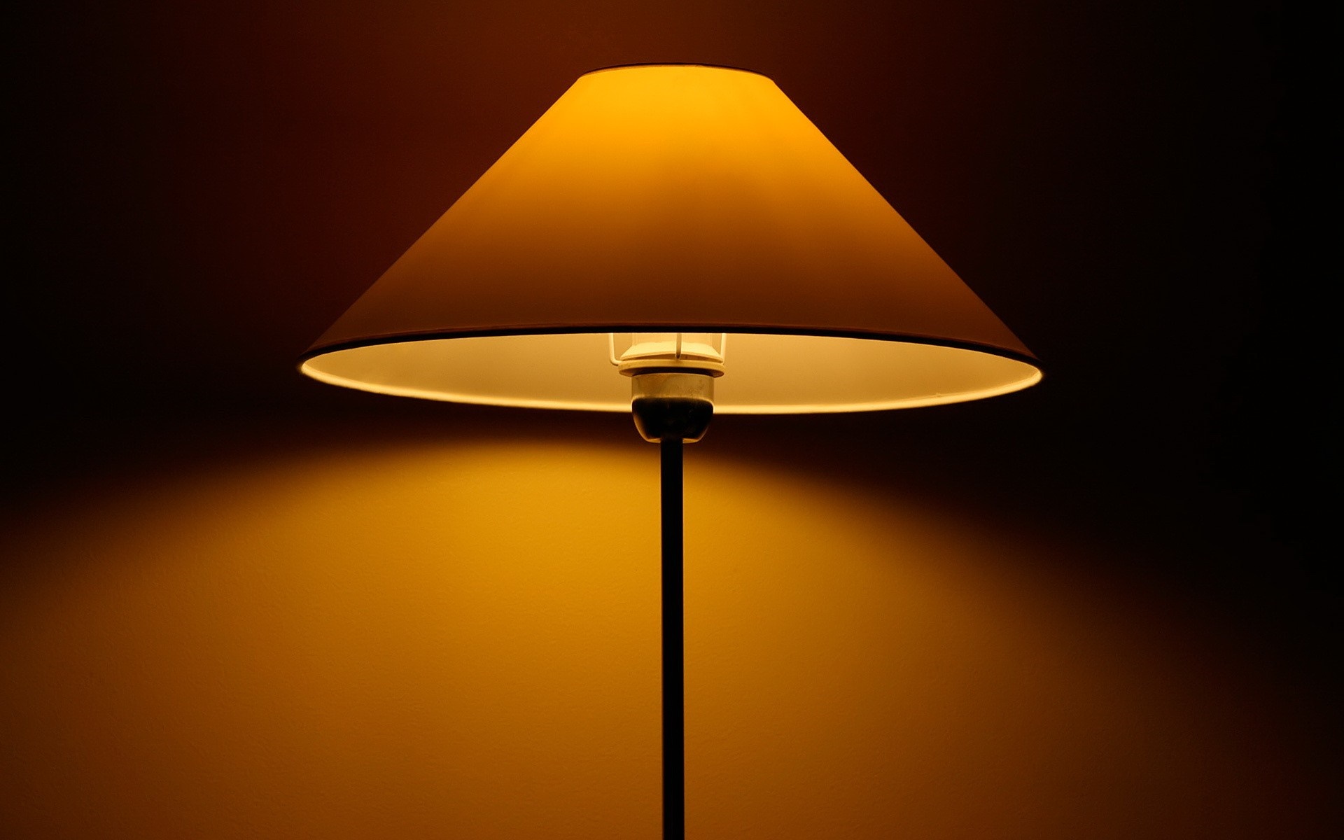 Yellow lampshade with light bulb and stand HD Wallpaper