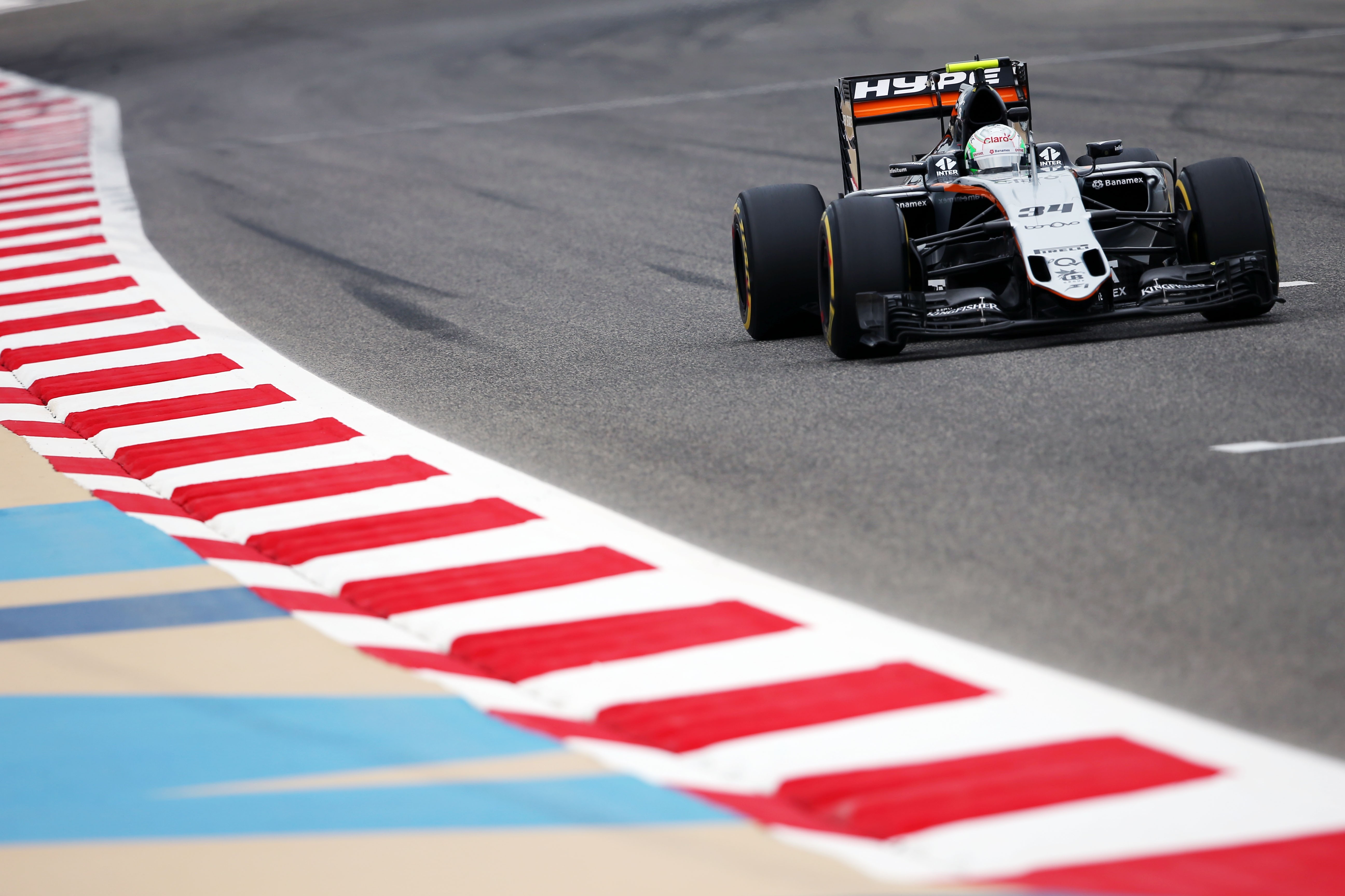 Force India Formula 1 car on a race track HD Wallpaper