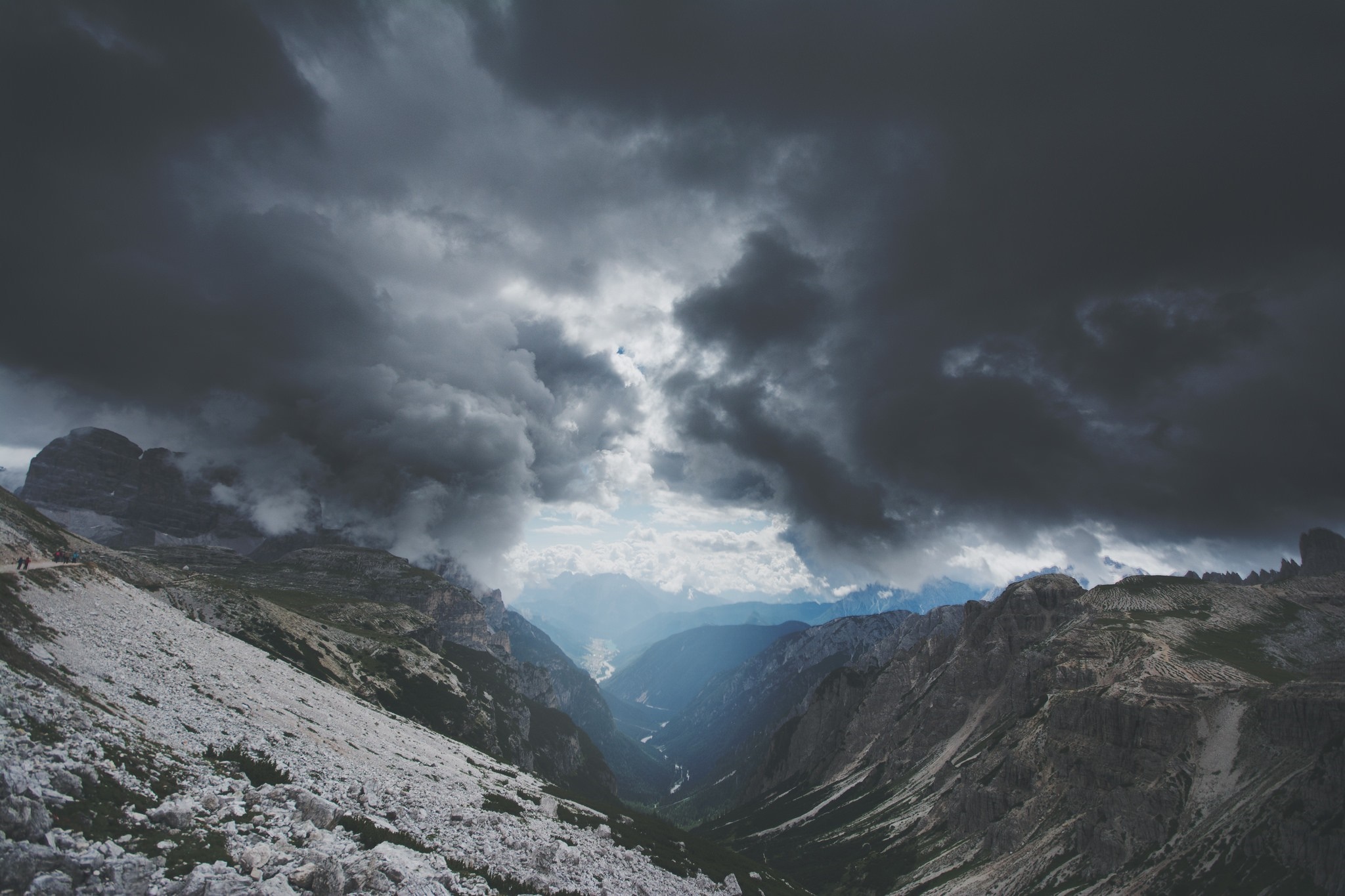 Stormy clouds over a mountain valley in the Alps HD Wallpaper