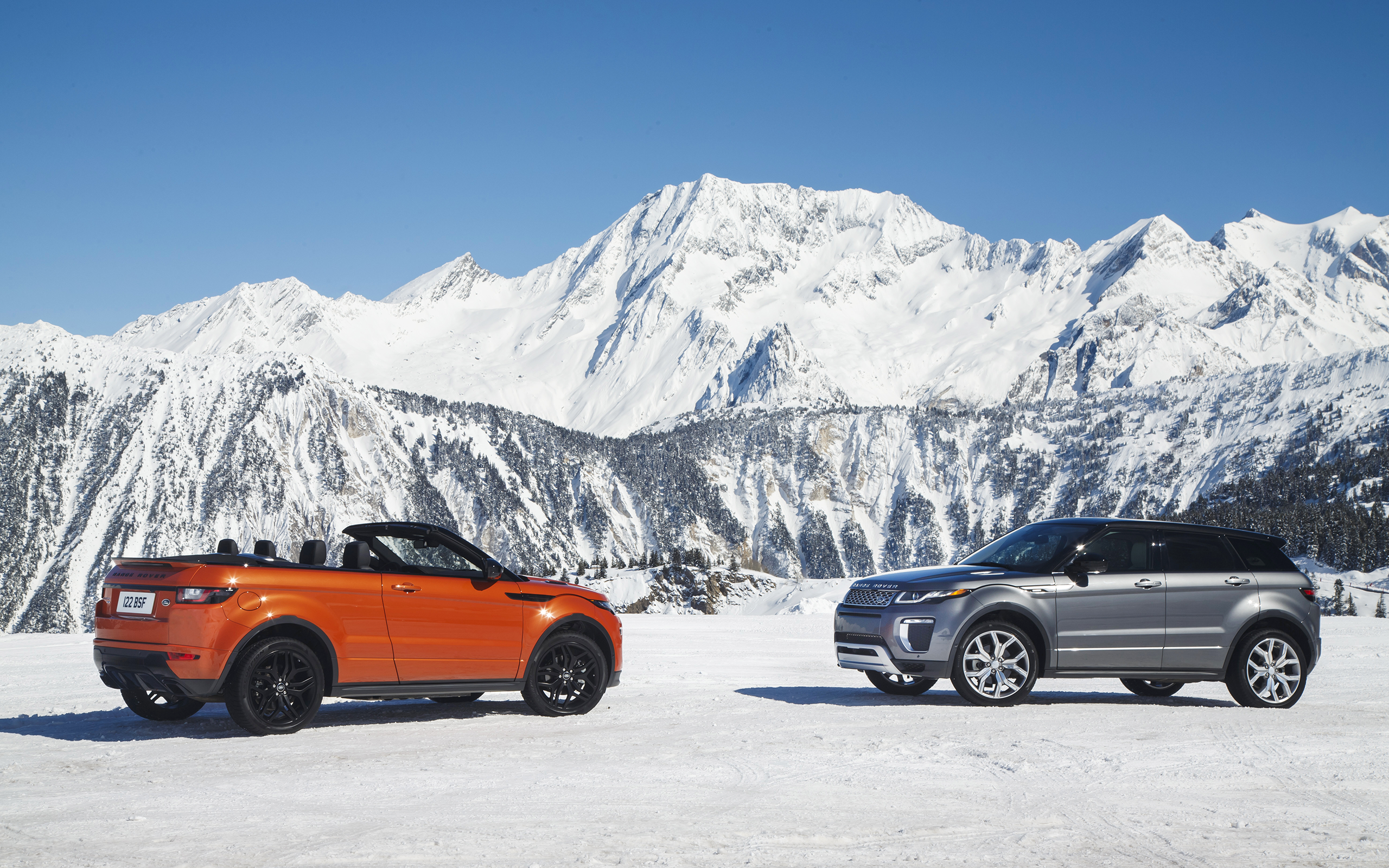 Range Rover Evoque Convertible and SUV in Snowy Mountains HD Wallpaper
